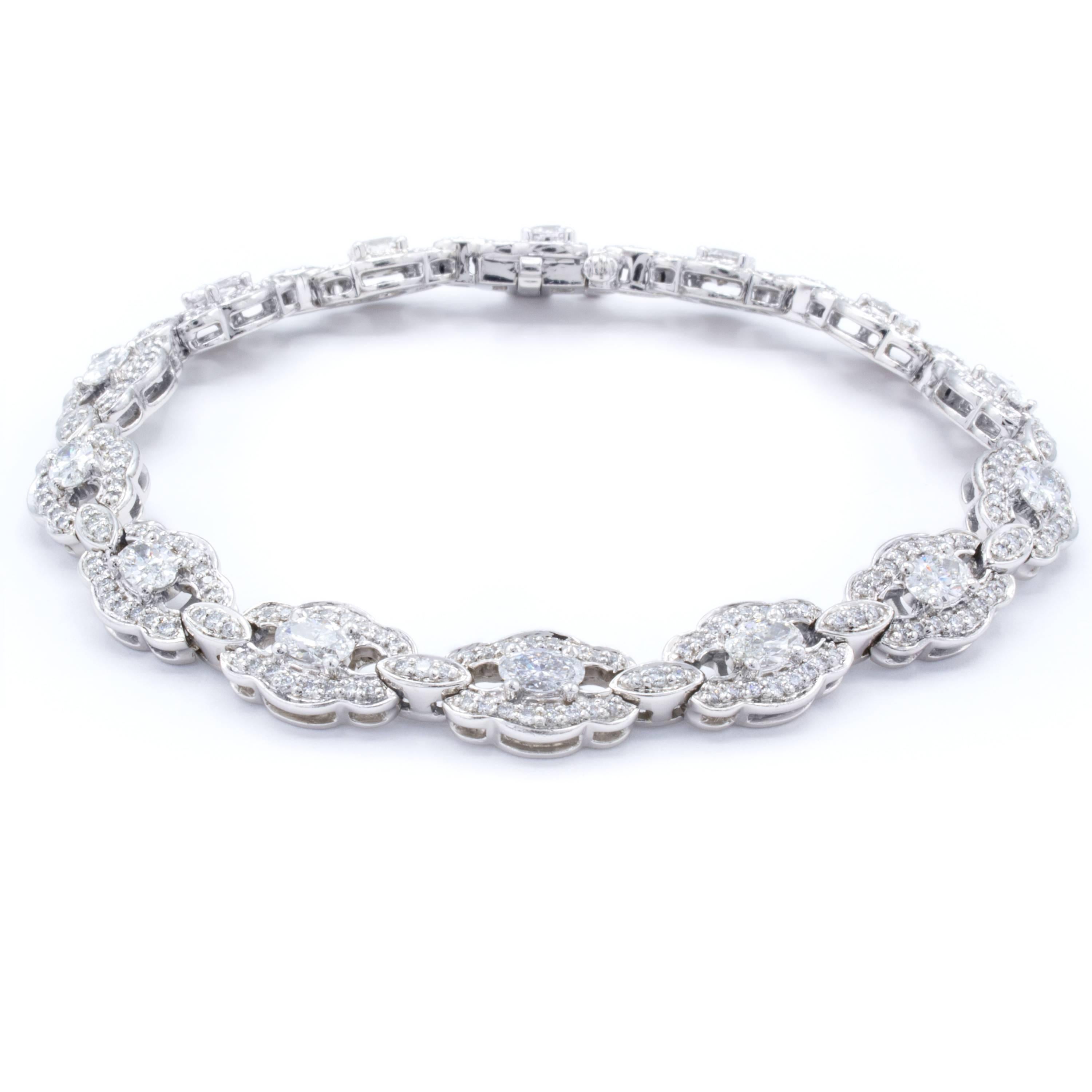 An elegant bracelet from Rosenberg Diamonds & Co. gathering 3.33 carats of glittering diamonds in oval cut and round brilliant shapes. The stones are set into a beautifully designed platinum band that is both slim and intricate enough to make the