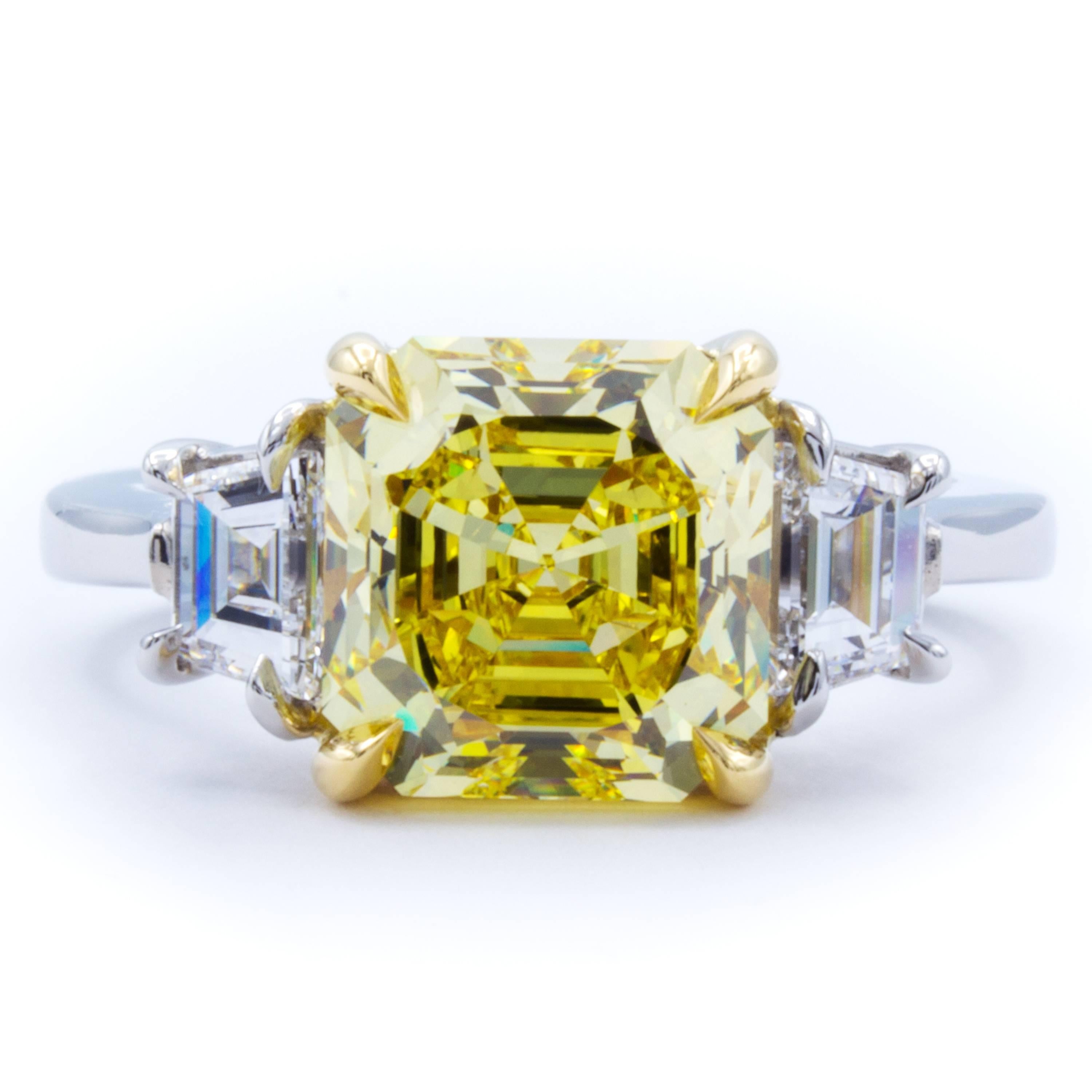This Rosenberg Diamonds & Co. engagement ring reaches toward the heart with an incredibly rich natural fancy vivid yellow GIA certified 3.39 carat asscher cut diamond. As natural fancy vivid is the best grading GIA attributes to color diamonds this