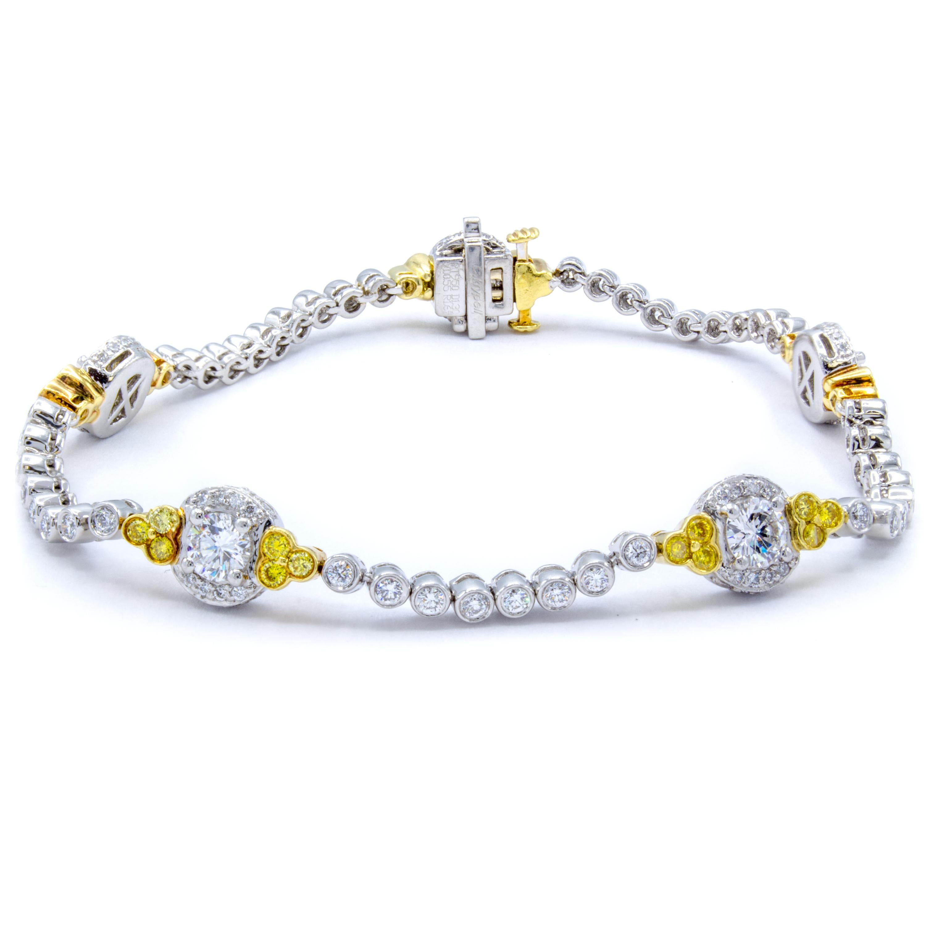This delightful diamond bracelet features 3.50 carats of both exceptional white round brilliant diamonds and the remarkable color from natural fancy yellow round brilliants. An elegant design in platinum and 18Kt yellow gold wraps gently around the
