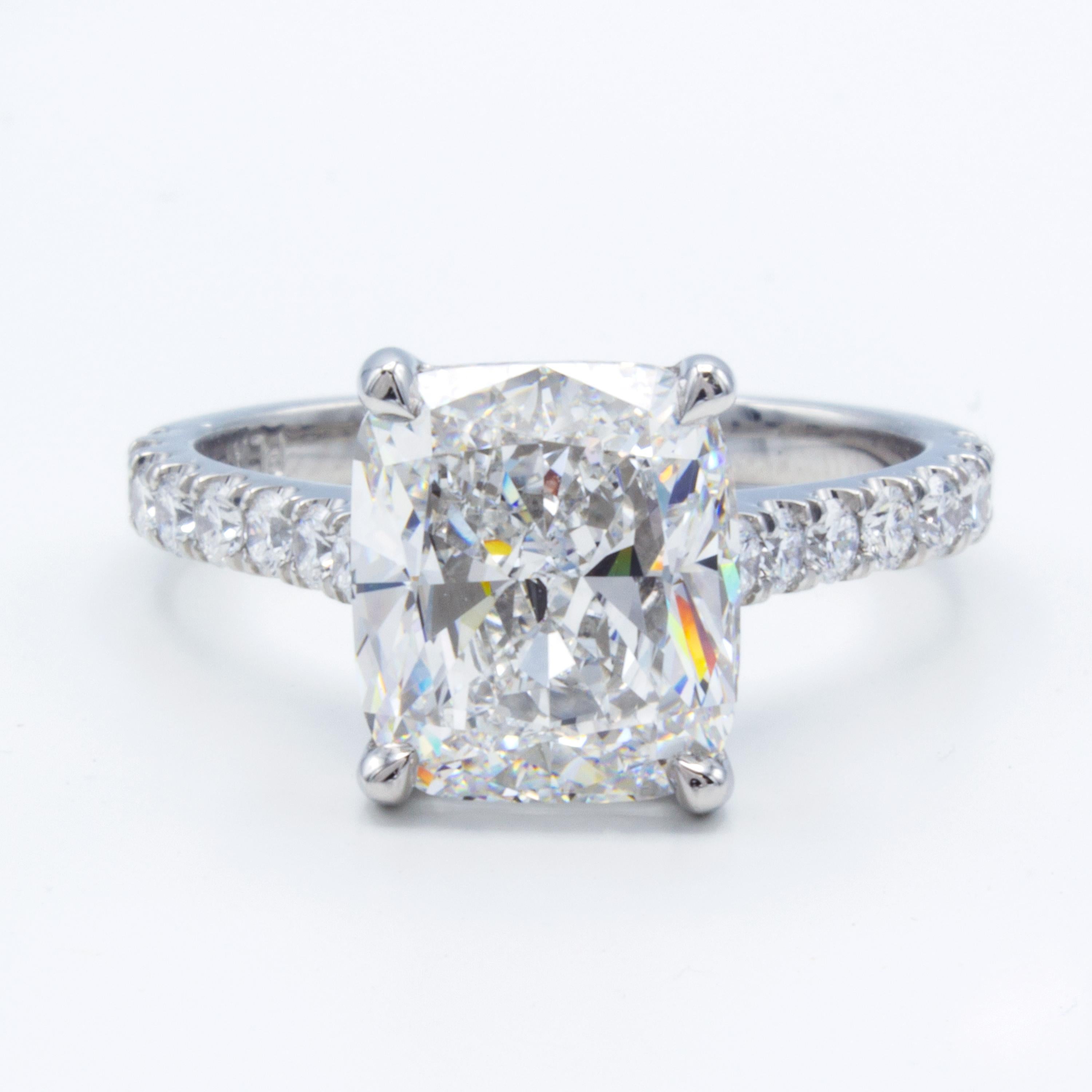 Rosenberg Diamonds & Co. 3.76 carat Cushion shape E color VVS2 Clarity is accompanied by a GIA certificate. This spectacular collection color is full brilliance that is set in a handmade platinum setting with beautiful round micro pave three
