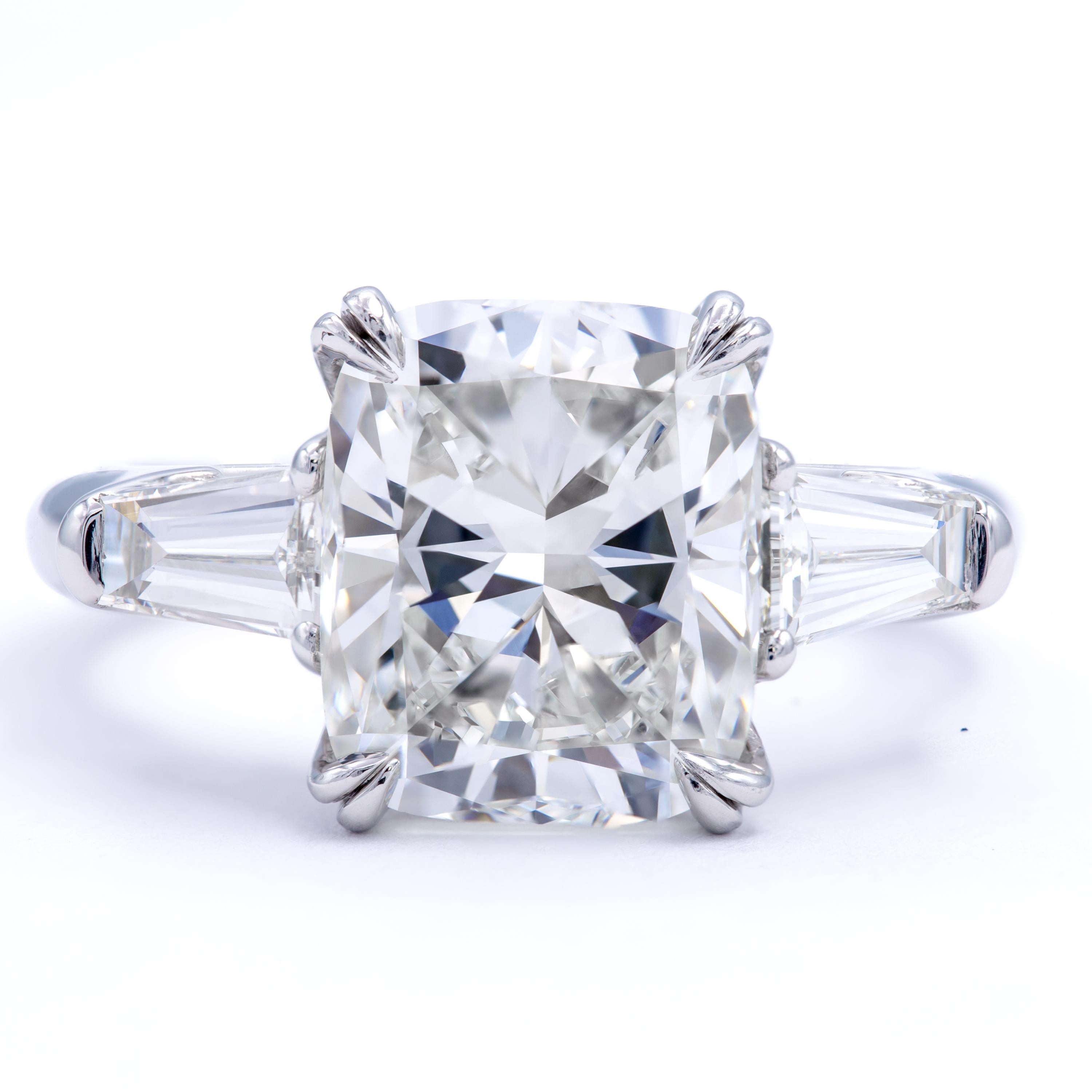 Rosenberg Diamonds 4.12 carat Cushion cut I color VS2 clarity is accompanied by a GIA certificate. This gorgeous Radiant is full of brilliance and it is set in a handmade platinum setting with perfectly matched pair of tapered baguette side stones