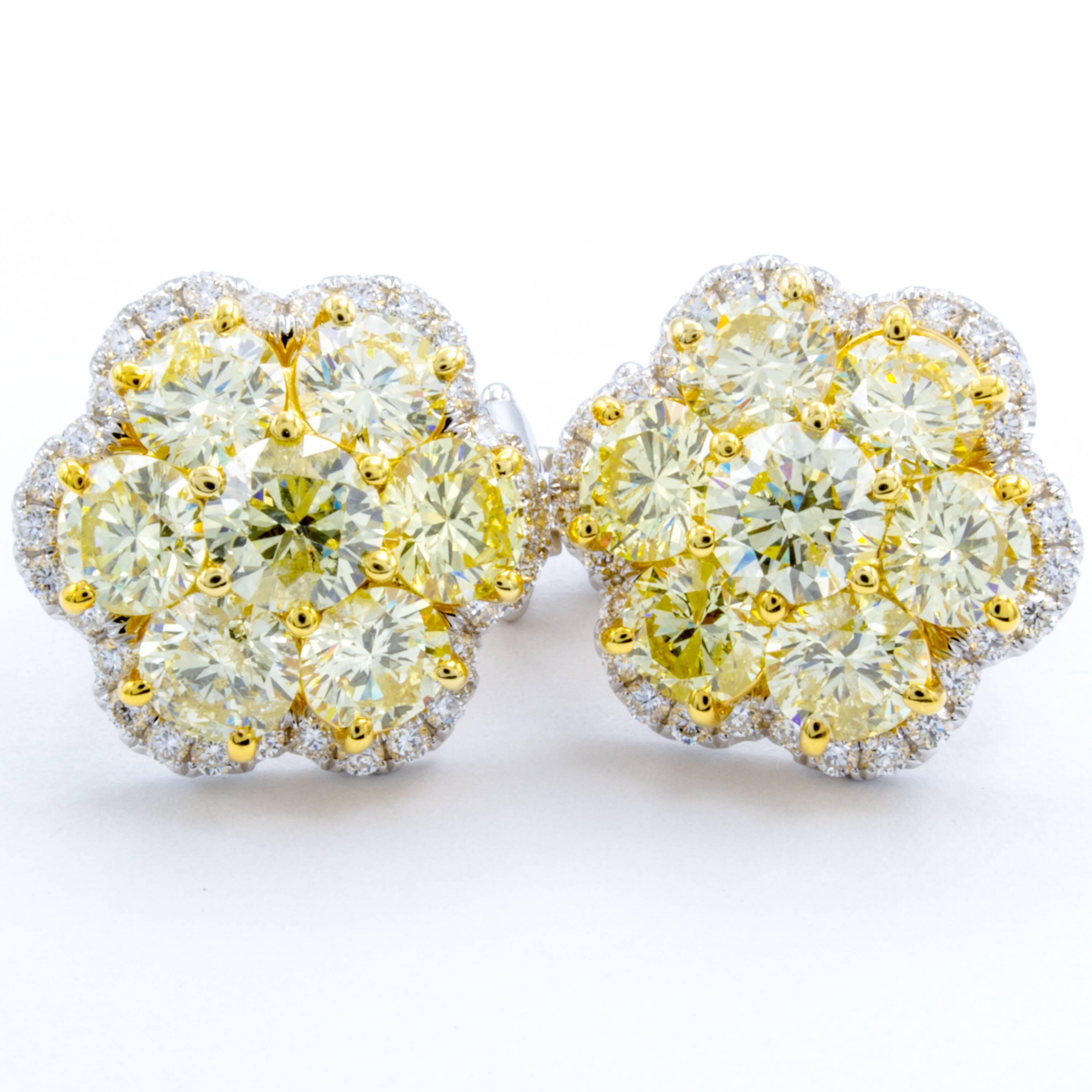 A brightly light bouquet of round brilliant diamonds show their rare natural fancy yellow color in these gorgeous stud earrings from Rosenberg Diamonds & Co. A total of 4.33 carats shine within these fancy yellow diamonds, 7 in each earring, all