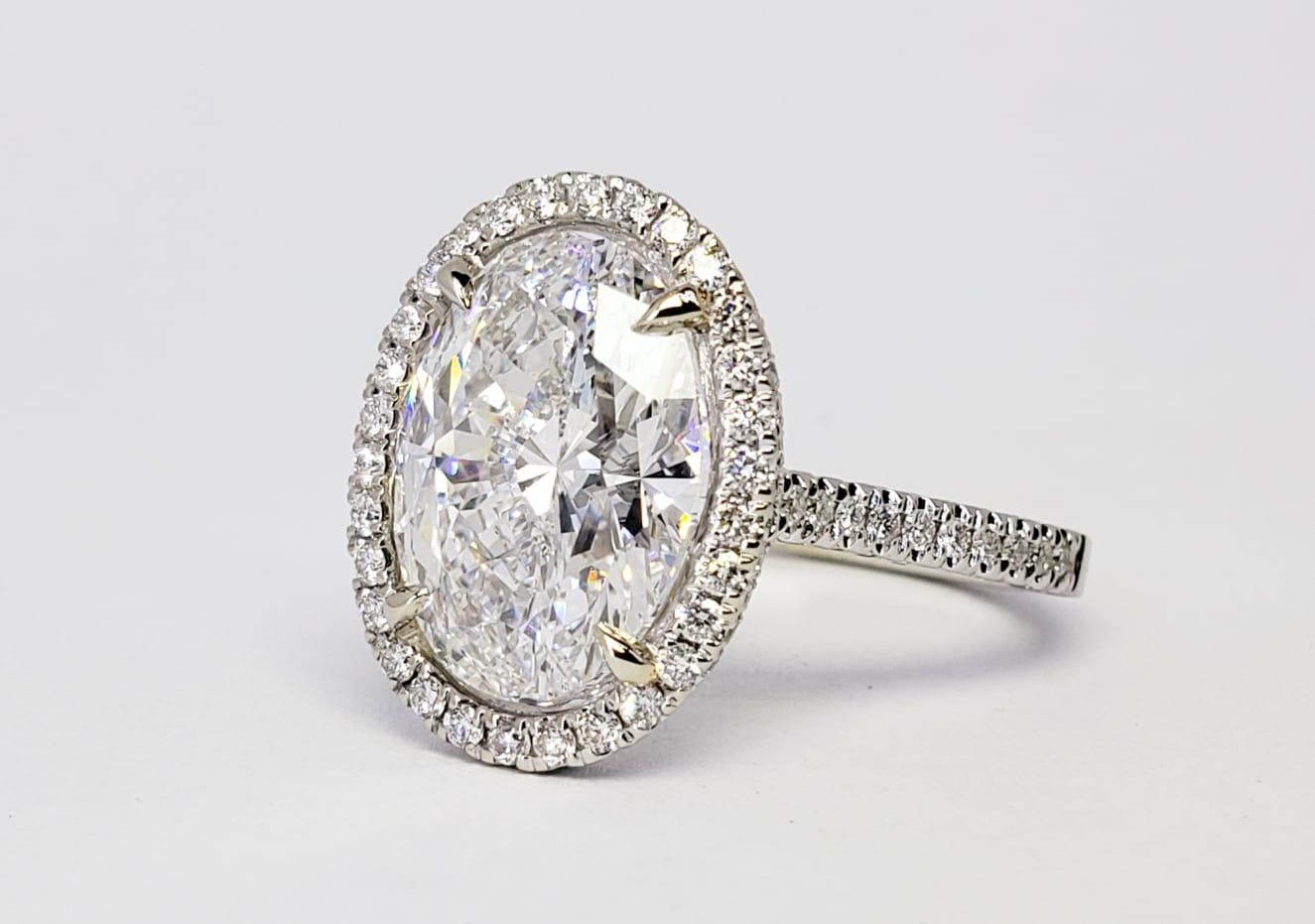 Rosenberg Diamonds & Co. 5.02 carat Oval shape D color VS2 clarity is accompanied by a GIA certificate. This impressive collection color engagement ring appears like a 7 carat diamond & set in a handmade 18 karat white gold setting. This ring