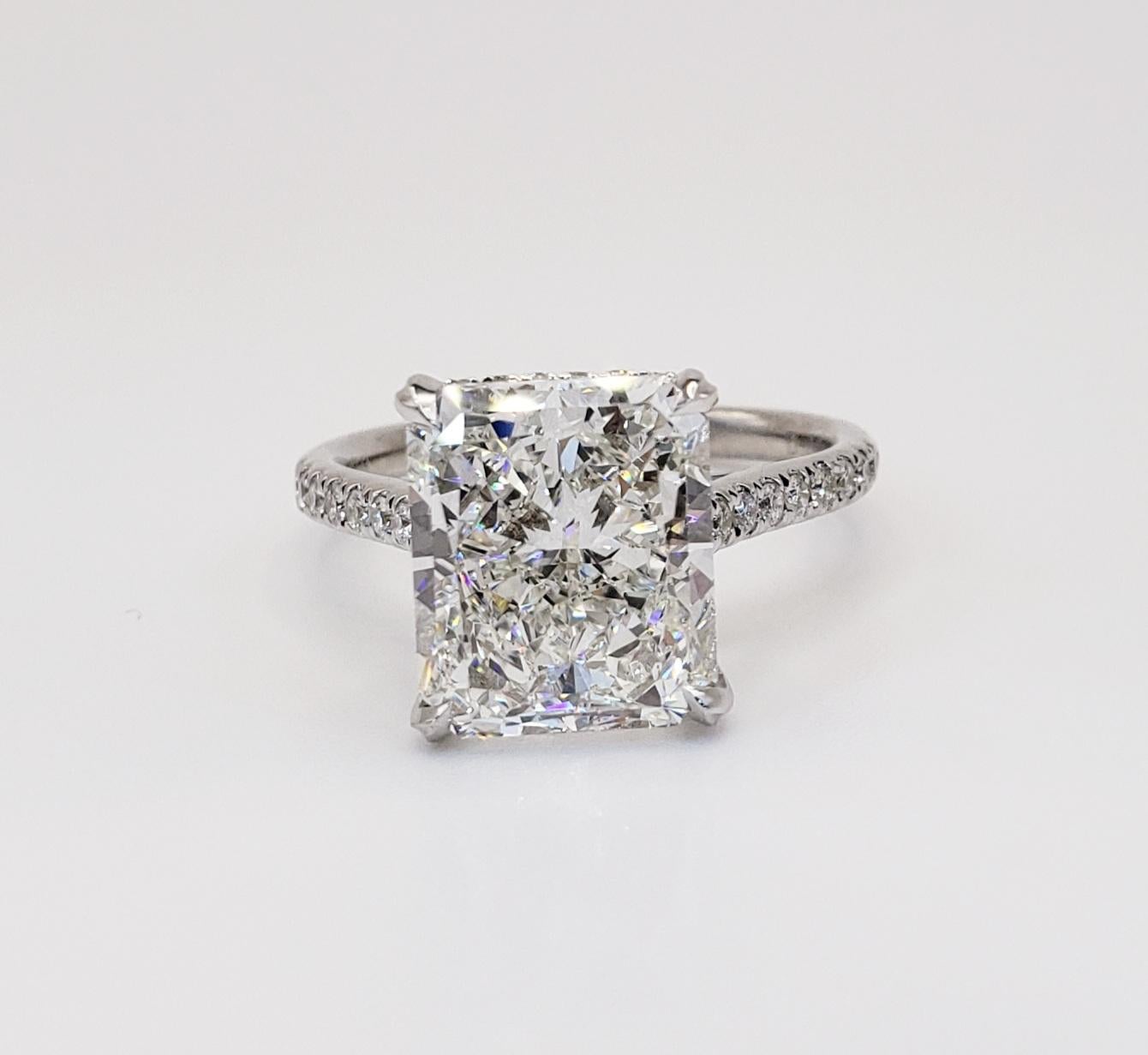 Rosenberg Diamonds & Co. 5.02 carat Radiant cut G color SI1 clarity is accompanied by a GIA certificate. This spectacular elongated Radiant is full of brilliance and it is set in a handmade 18k white gold setting. This ring continues its elegance