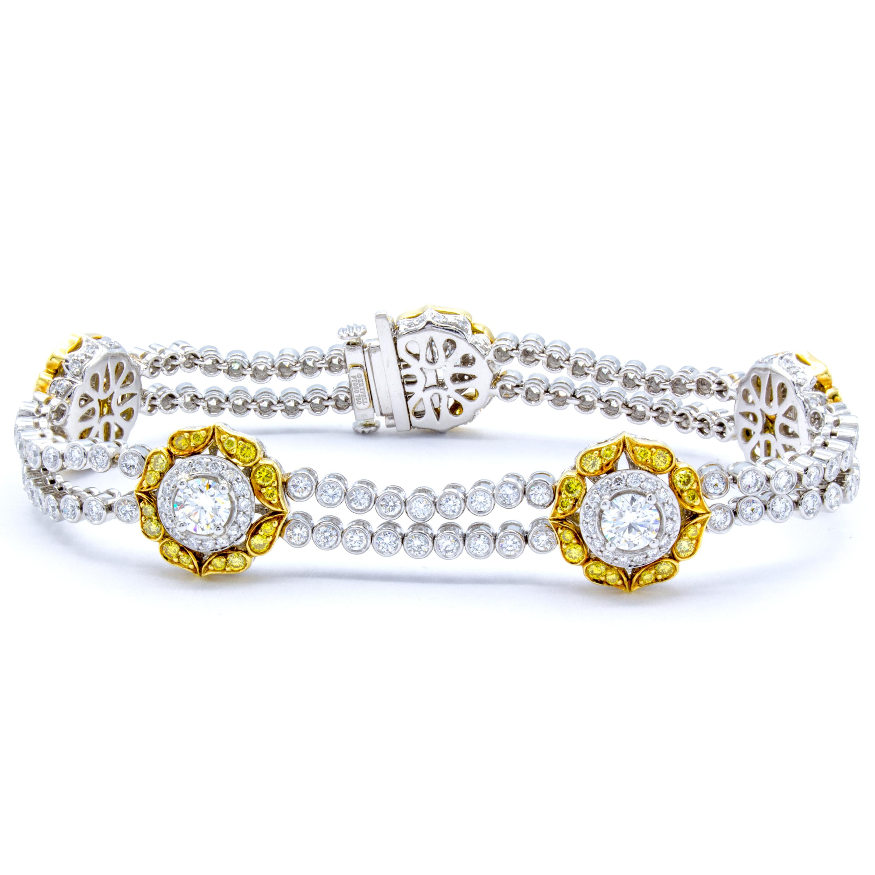 This delightful diamond bracelet features 5.77 carats of both exceptional white round brilliant diamonds and the remarkable color from natural fancy yellow round brilliants. An elegant design carries two symmetric rows in platinum connected by 18Kt