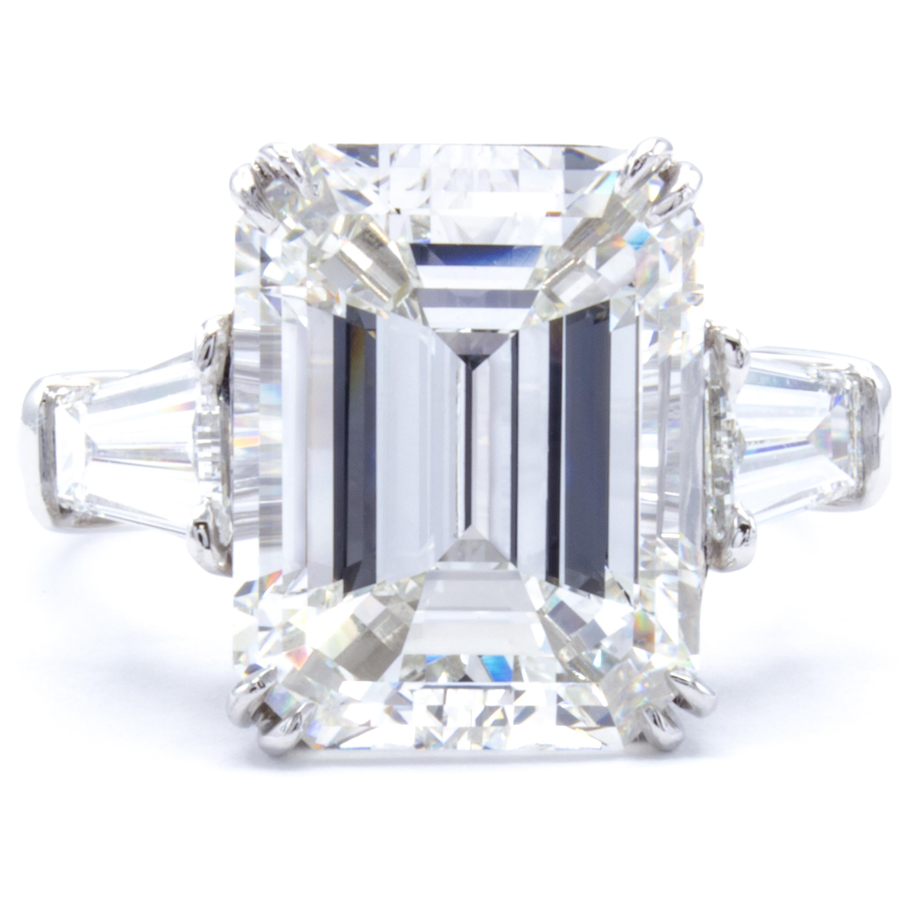 An exceptional rarity in both size and character. This Rosenberg Diamonds & Co. engagement ring features an astounding 7.07 carat emerald cut diamond. A band of bright platinum makes for the perfect accompaniment to this collection quality stone as