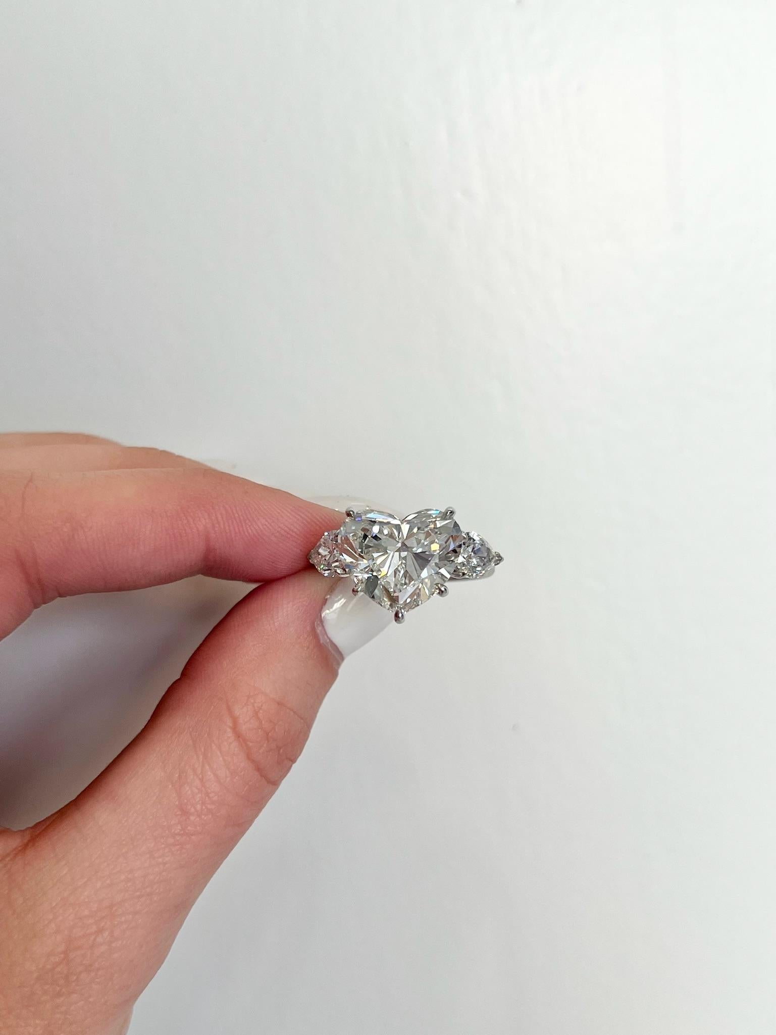 David Rosenberg 7.09 Carat Heart Shape F VS2 GIA 3 Stone Diamond Engagement Ring For Sale 4