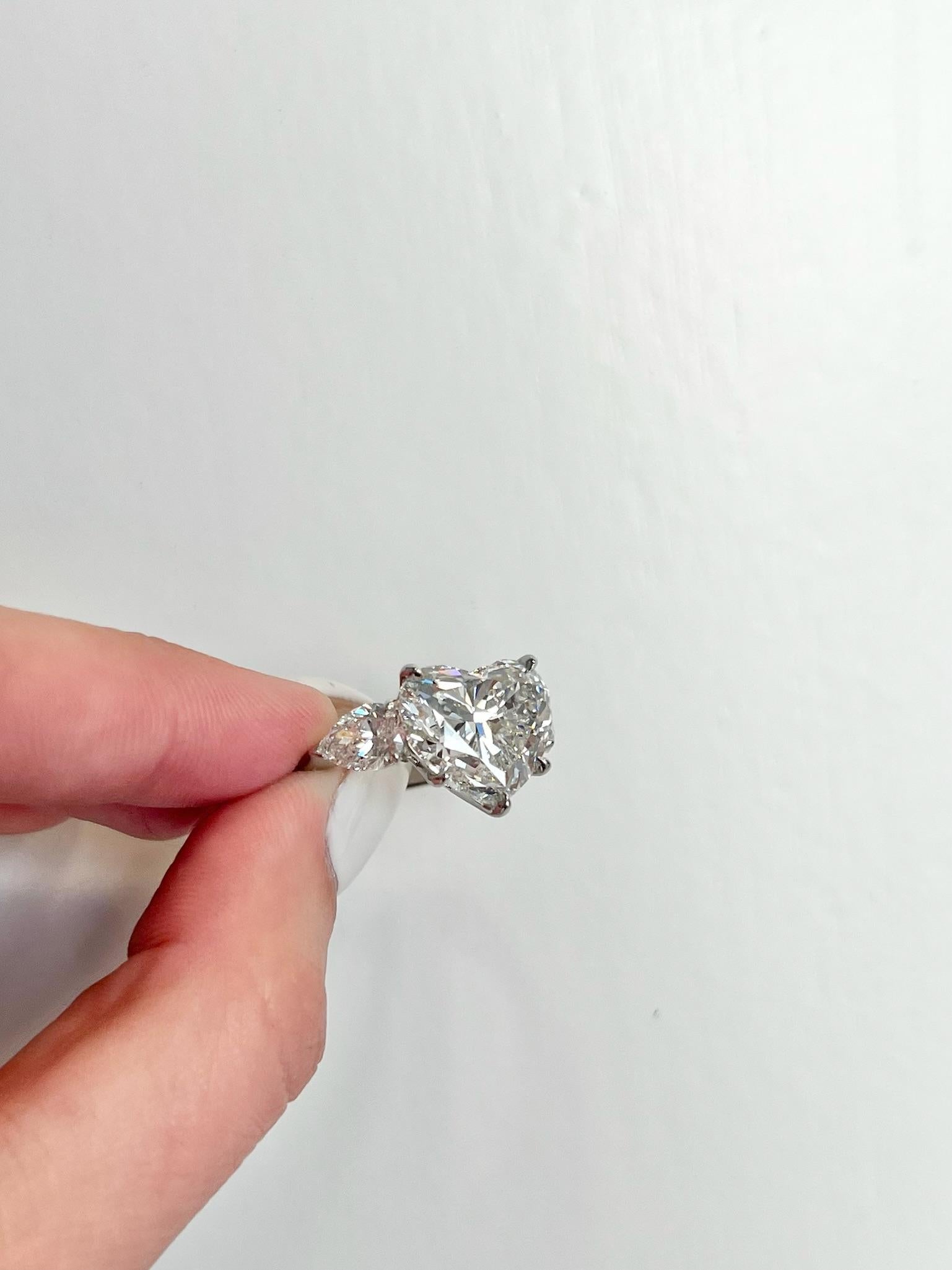 David Rosenberg 7.09 Carat Heart Shape F VS2 GIA 3 Stone Diamond Engagement Ring For Sale 5