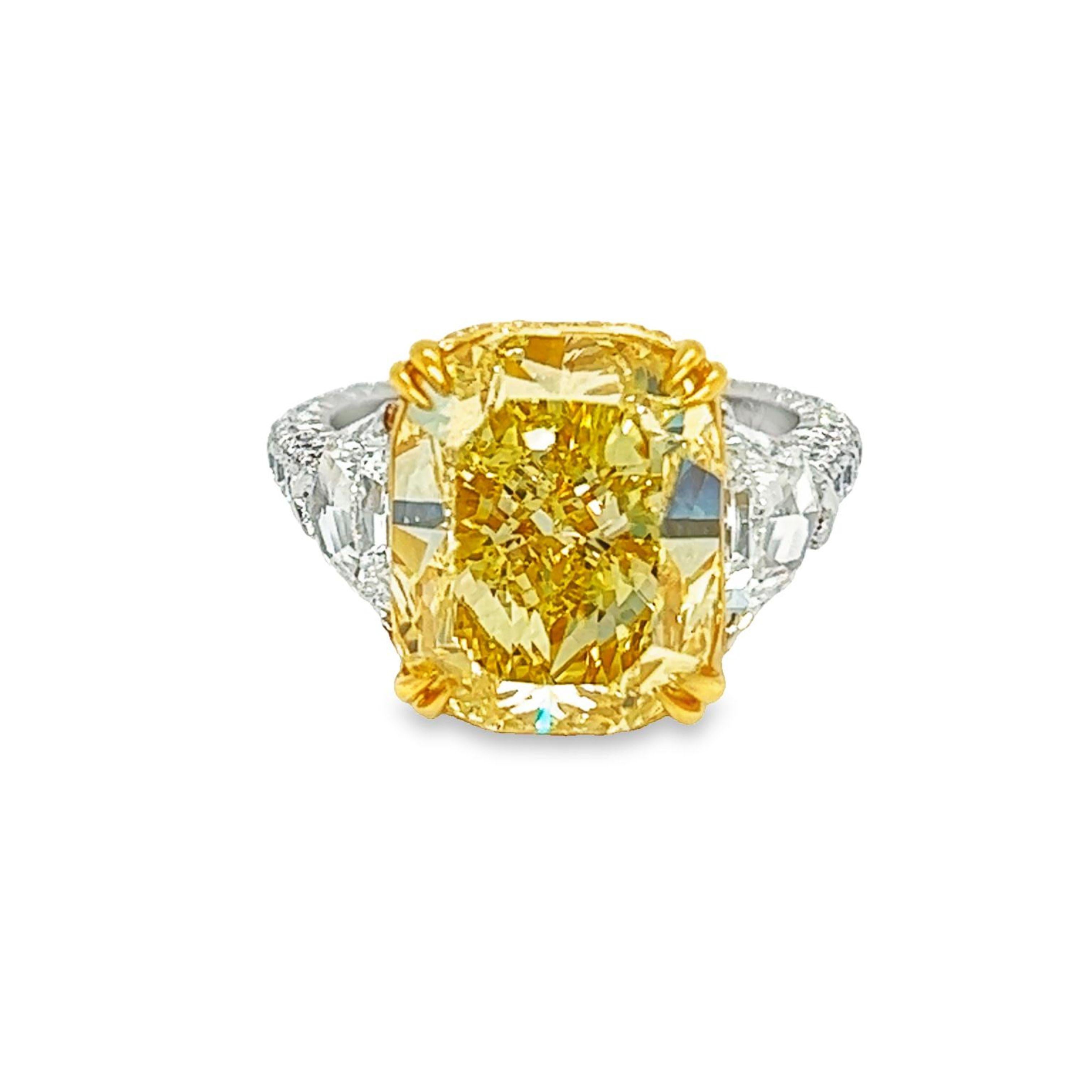 Rosenberg Diamonds & Co. 8.02 carat Cushion Cut Fancy Yellow VS1 clarity is accompanied by a GIA certificate. This beautiful bright cushion cut is set in a handmade platinum & 18k yellow gold setting with perfectly matched pair of epaulettes side