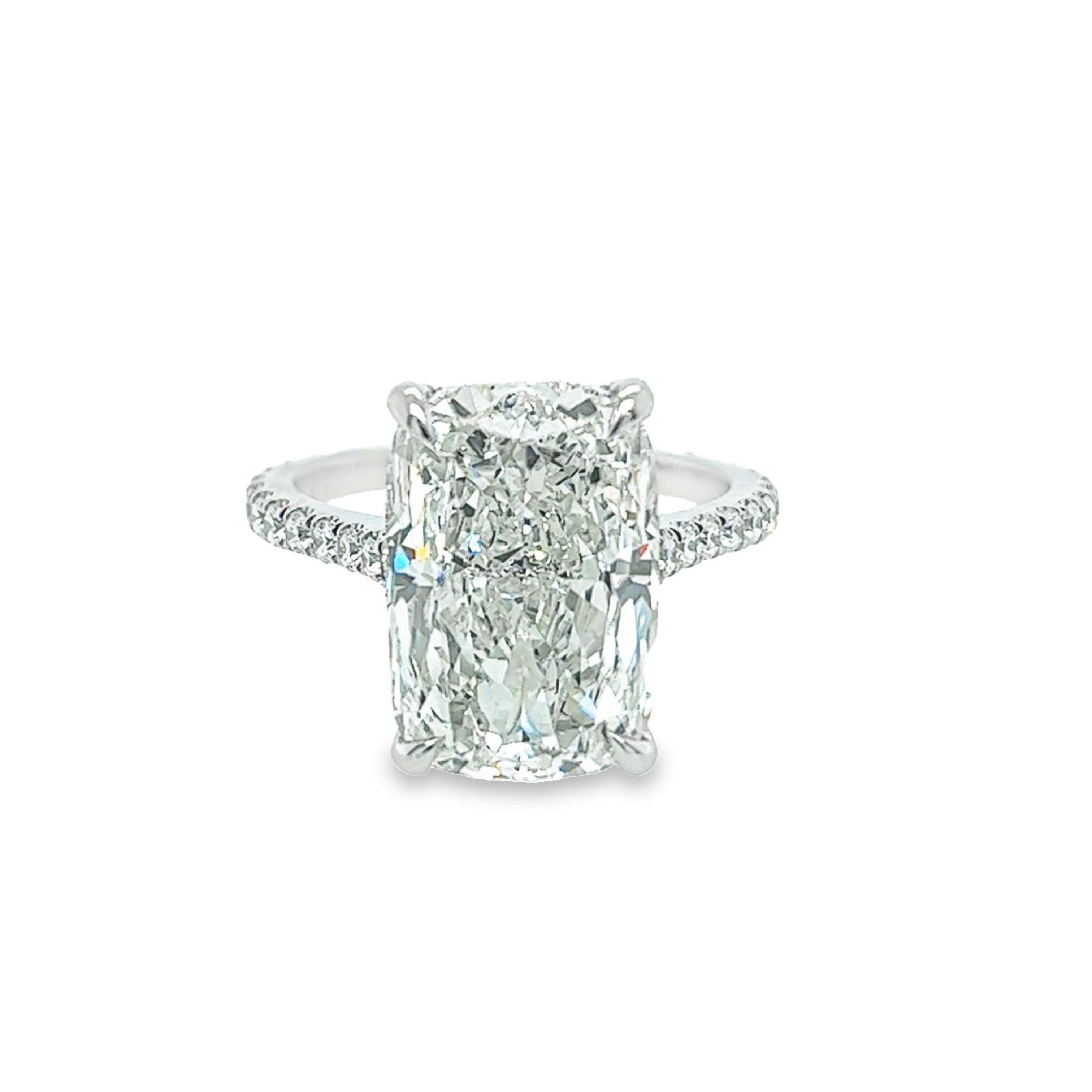 Rosenberg Diamonds & Co. 8.07 carat Cushion cut H color SI1 clarity is accompanied by a GIA certificate. This breathtaking elongated Cushion is full of brilliance and an exceptional SI1 that is set in a handmade platinum setting. This ring continues