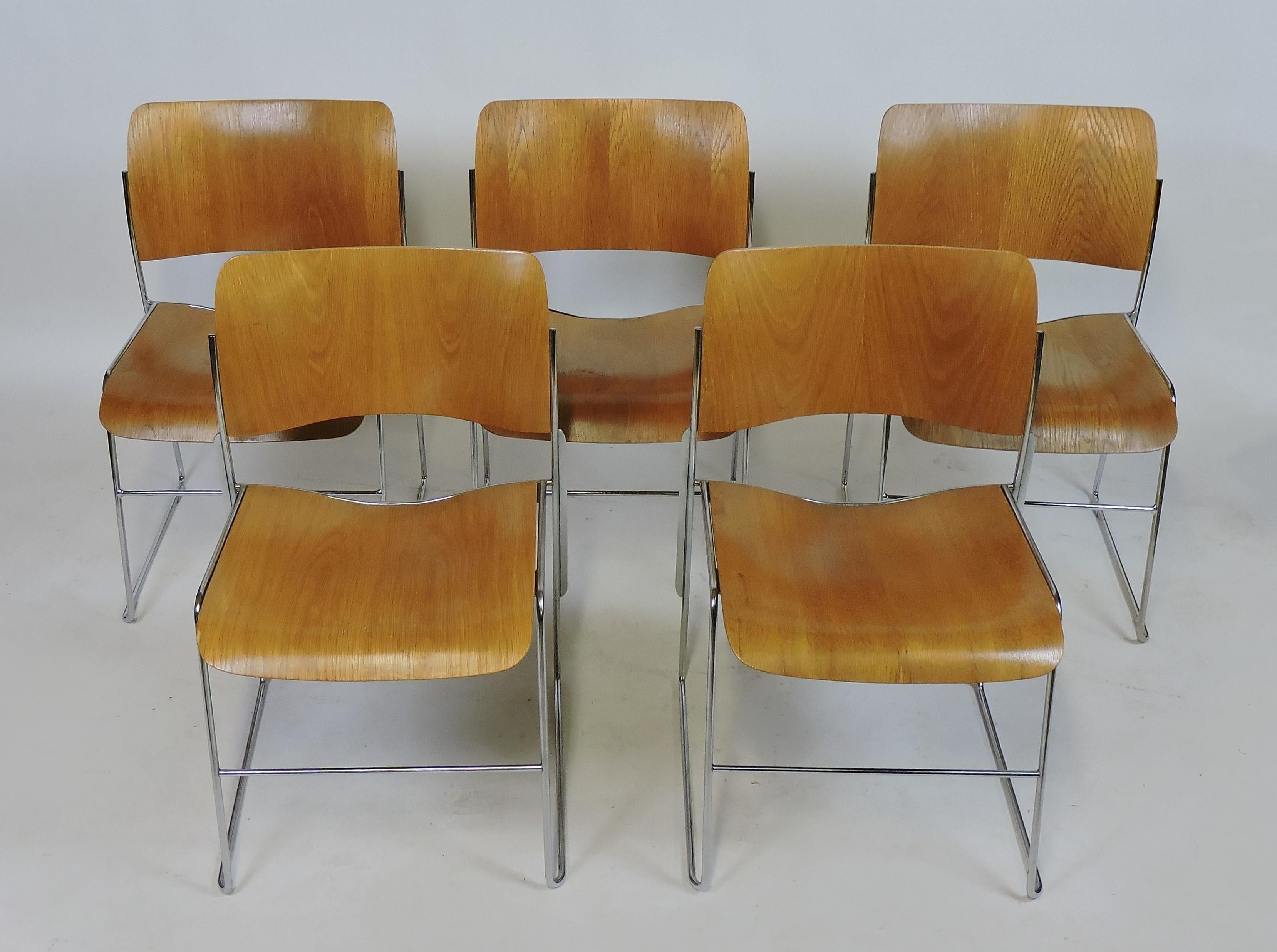David Rowland 40/4 stacking chair in blonde ash bentwood with a steel frame. Forty chairs can be stacked in four feet and they can also be linked together. Award winning design, these are elegant and durable.
Two of these are from 1974 and three