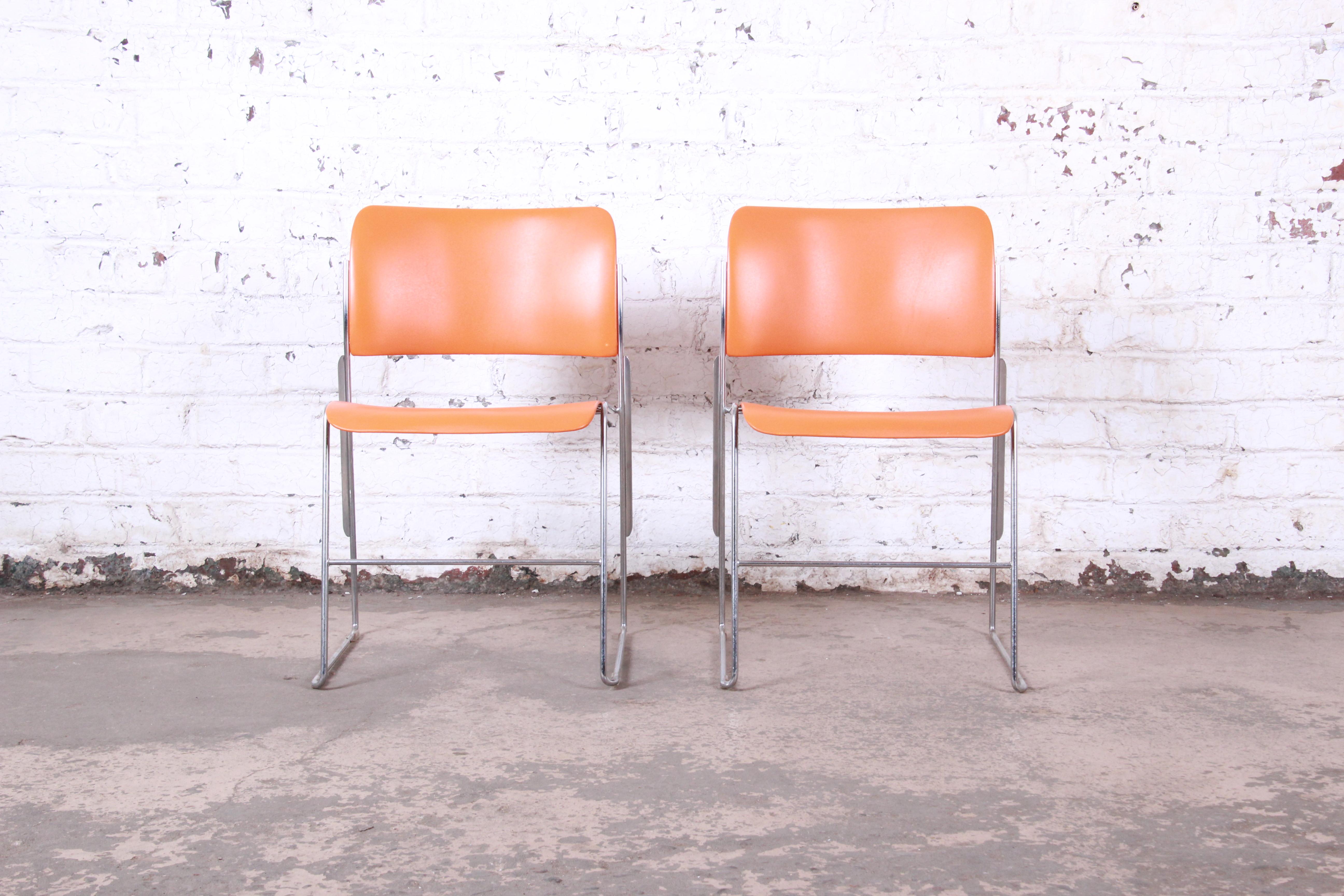 Vintage 40/4 orange and chrome stacking chairs

Designed by David Rowland,

USA, 1977

Chrome and orange powder-coated steel

Measures: 20.13