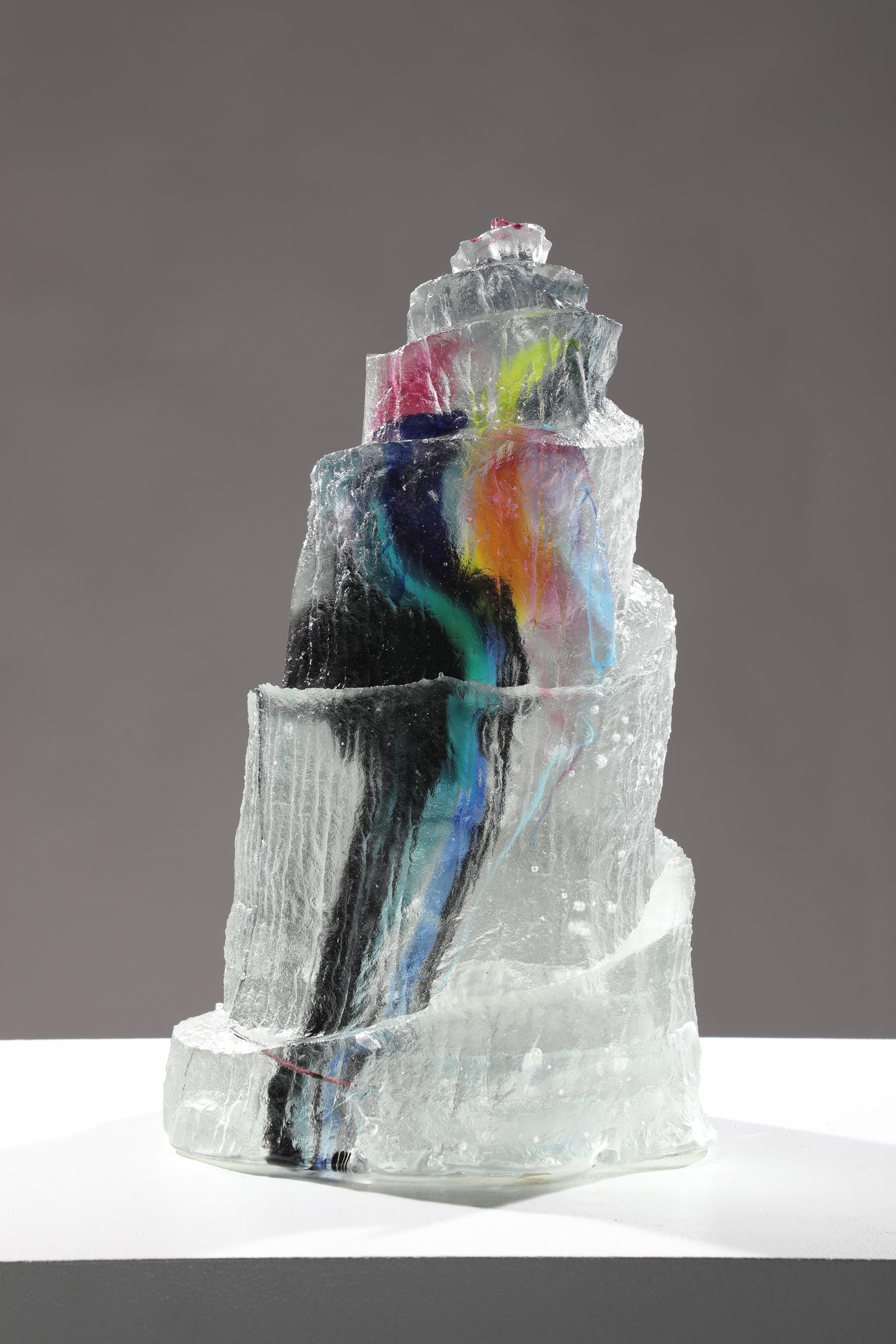 'Al Okab' is a contemporary abstract cast glass sculpture by David Ruth from his Internal Space series.  This part of the series was inspired by astronomy and the distant galaxies and stars. David fused of various colored glass creates a layered,
