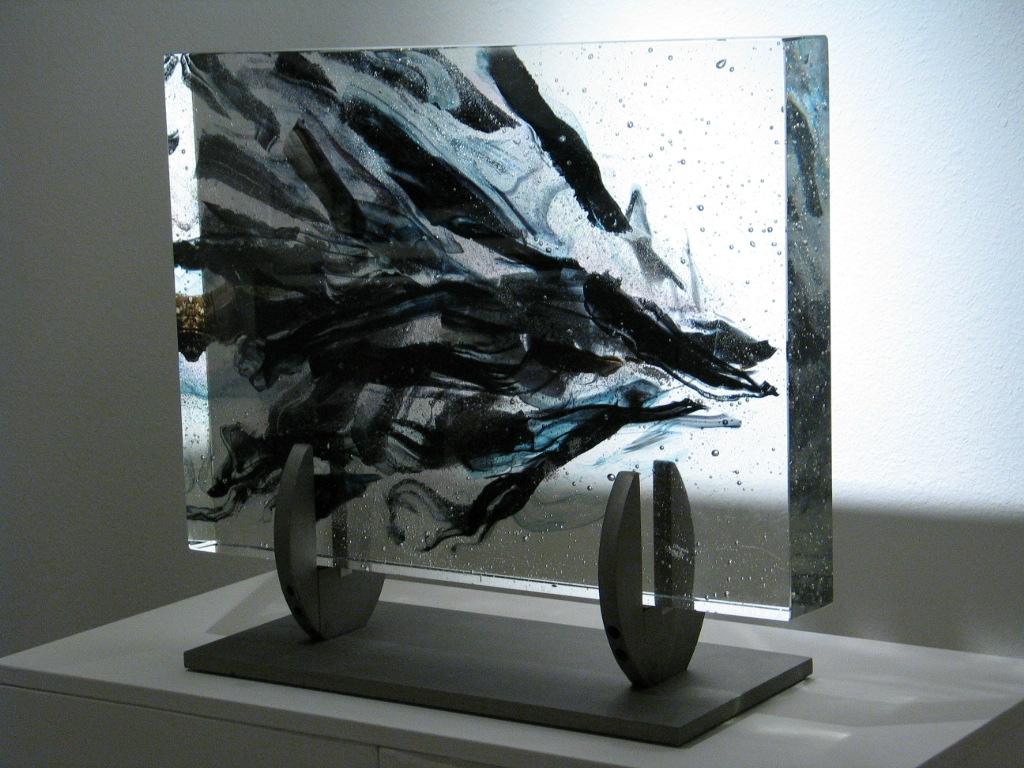 'Haumi' is a contemporary abstract cast glass sculpture by David Ruth from his Internal Space series. It features painterly brushstroke formations in glass called trails. Trails are created through rolling molten glass into various forms and shapes.