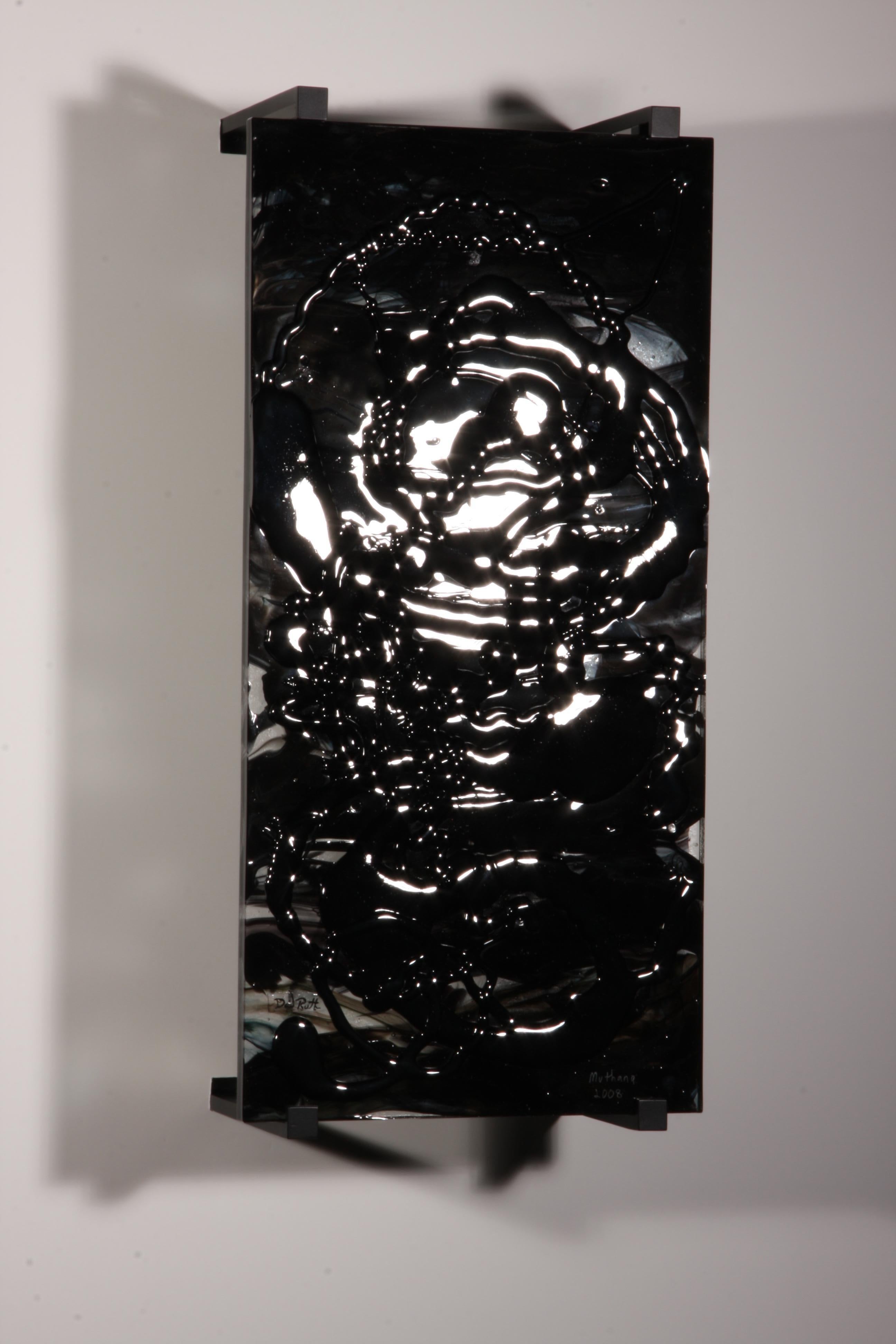 'Muthana' is a contemporary abstract glass by artist David Ruth. Created in 2008, it was a piece in a series about the David's views on the American invasion of Iraq. 

