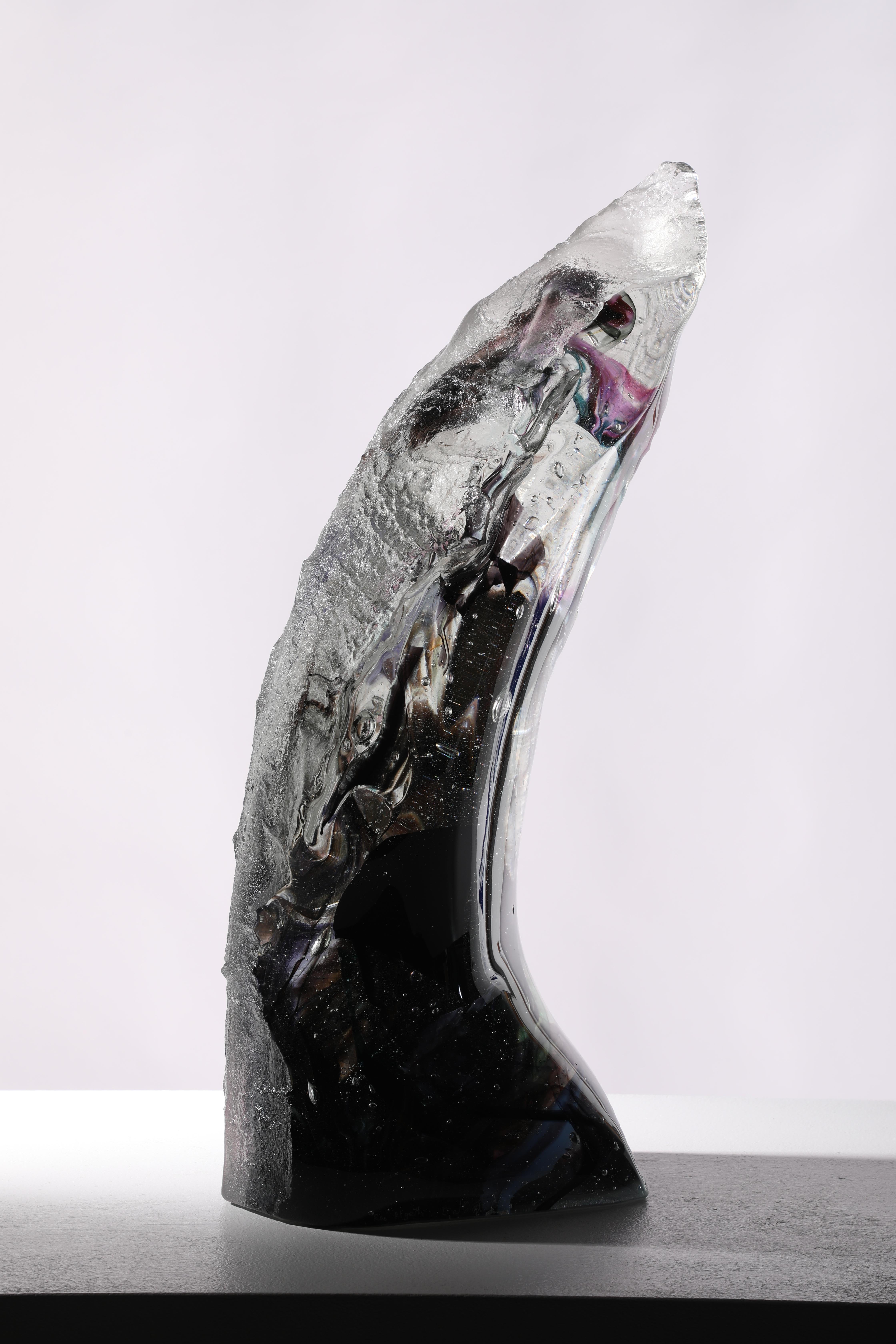 'Ras Algethi' is a contemporary abstract cast glass sculpture by David Ruth from his Internal Space series.  This part of the series was inspired by astronomy and the distant galaxies and stars. David fused various colored glass creates a layered,