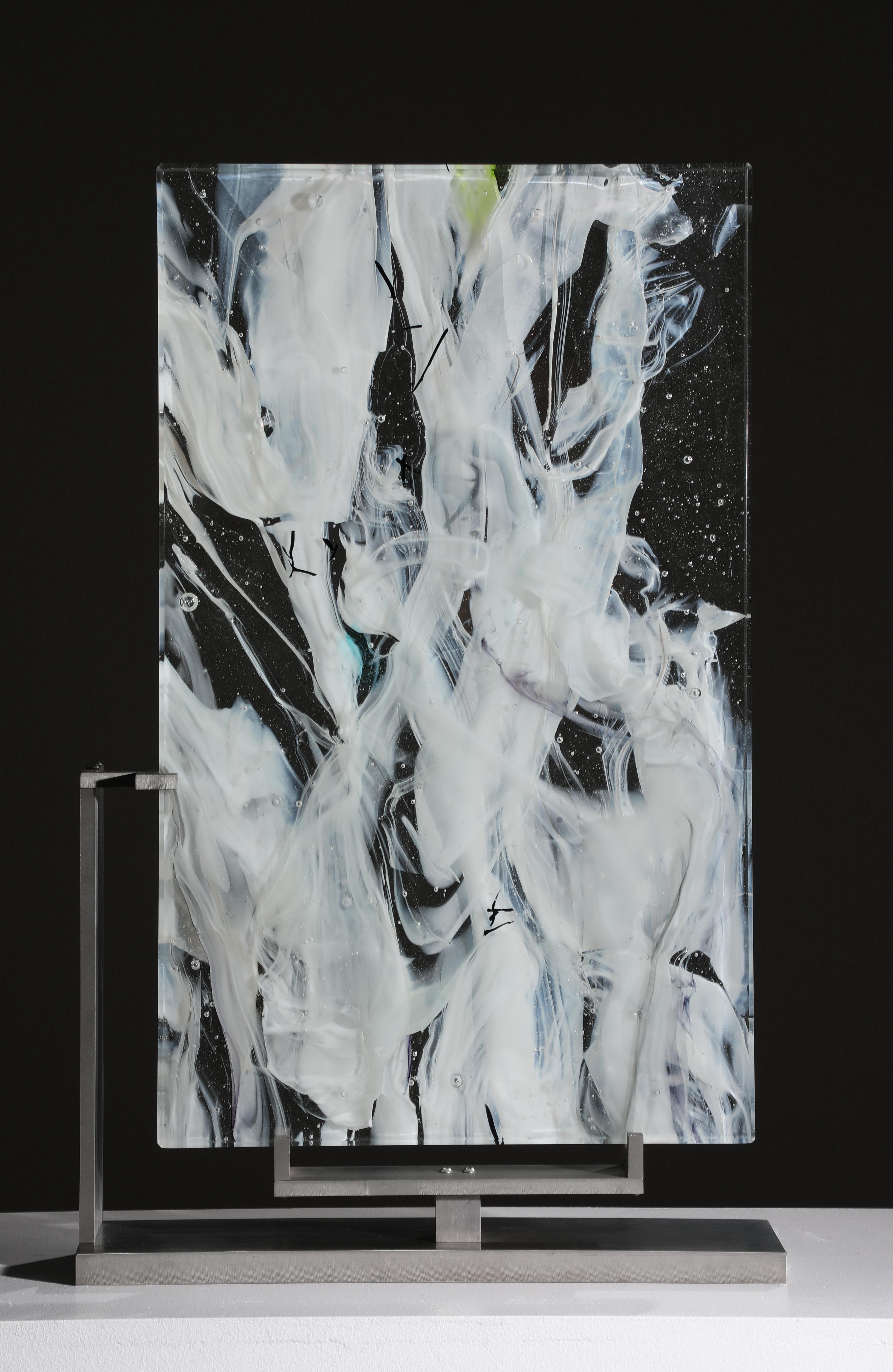 Cloud Study #4 is a contemporary abstract glass sculpture by David Ruth from his Cloud Study Series. It contains hues of white, yellow and black painterly brushstroke formations in glass called trails. Trails are created through rolling molten glass