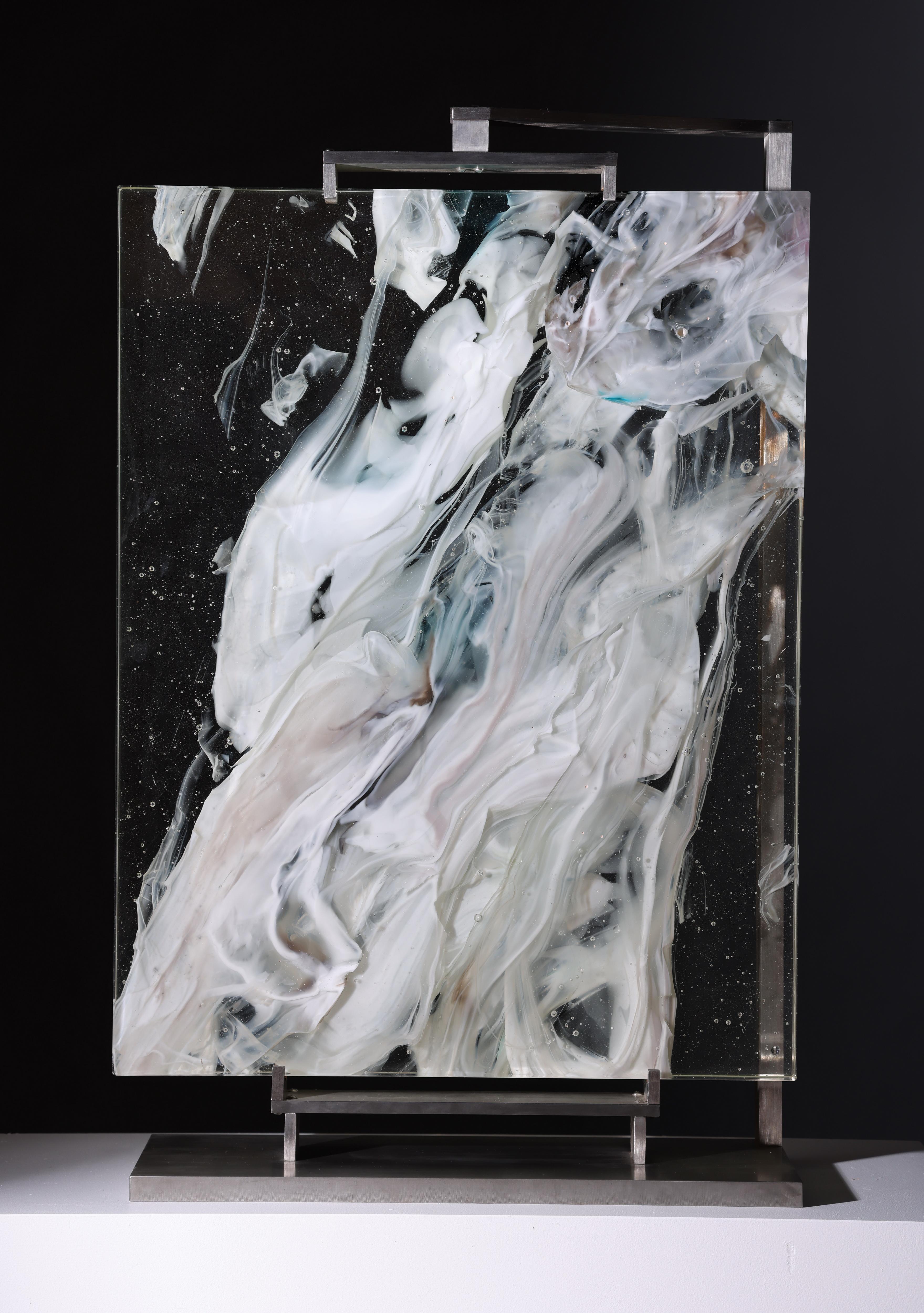 Cloud Study #6 is a contemporary abstract glass sculpture by David Ruth from his Cloud Study Series. It contains hues of white, yellow and black painterly brushstroke formations in glass called trails. Trails are created through rolling molten glass