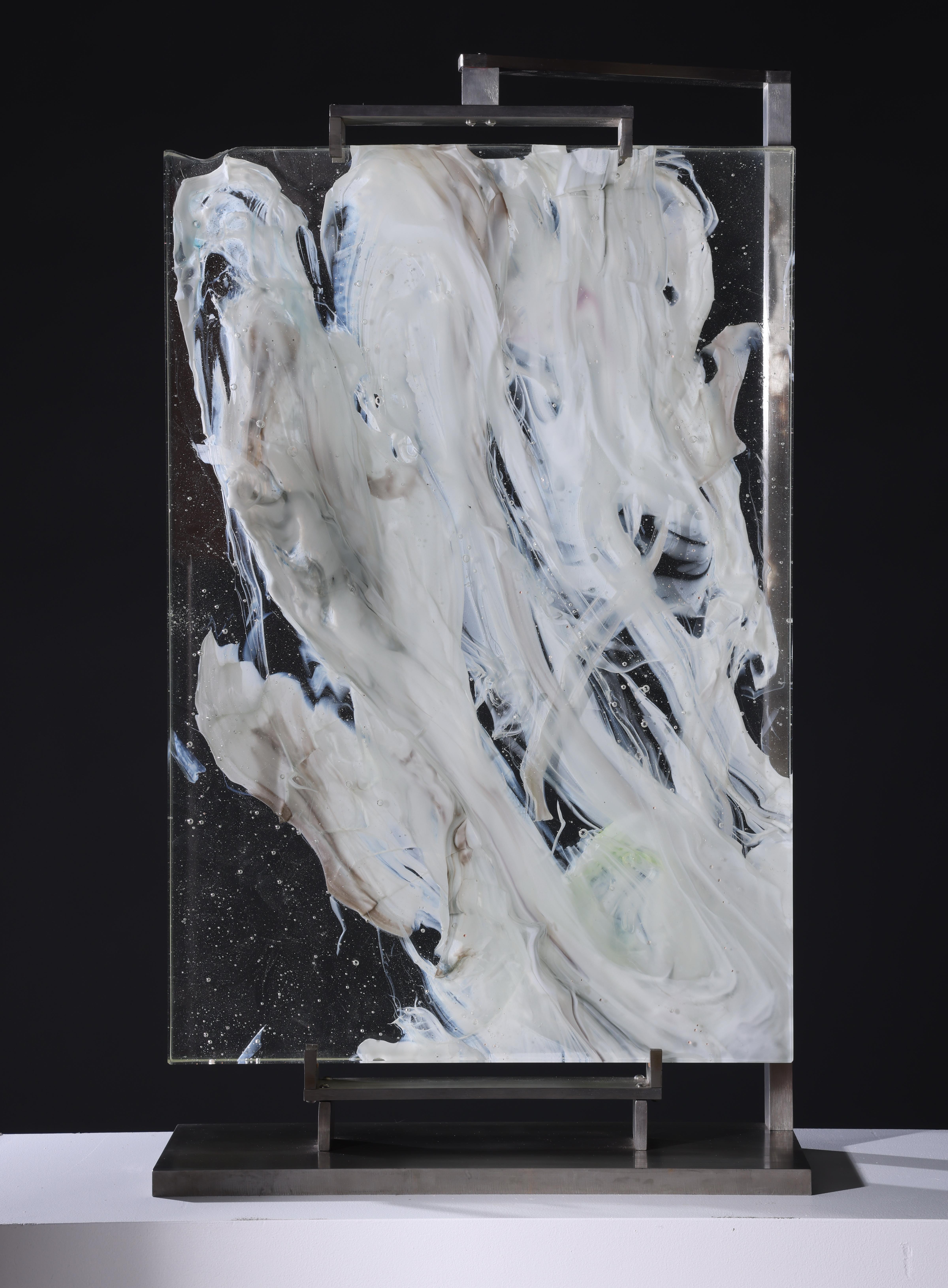 Cloud Study #5 is a contemporary abstract glass sculpture by David Ruth from his Cloud Study Series. It contains hues of white, yellow and black painterly brushstroke formations in glass called trails. Trails are created through rolling molten glass