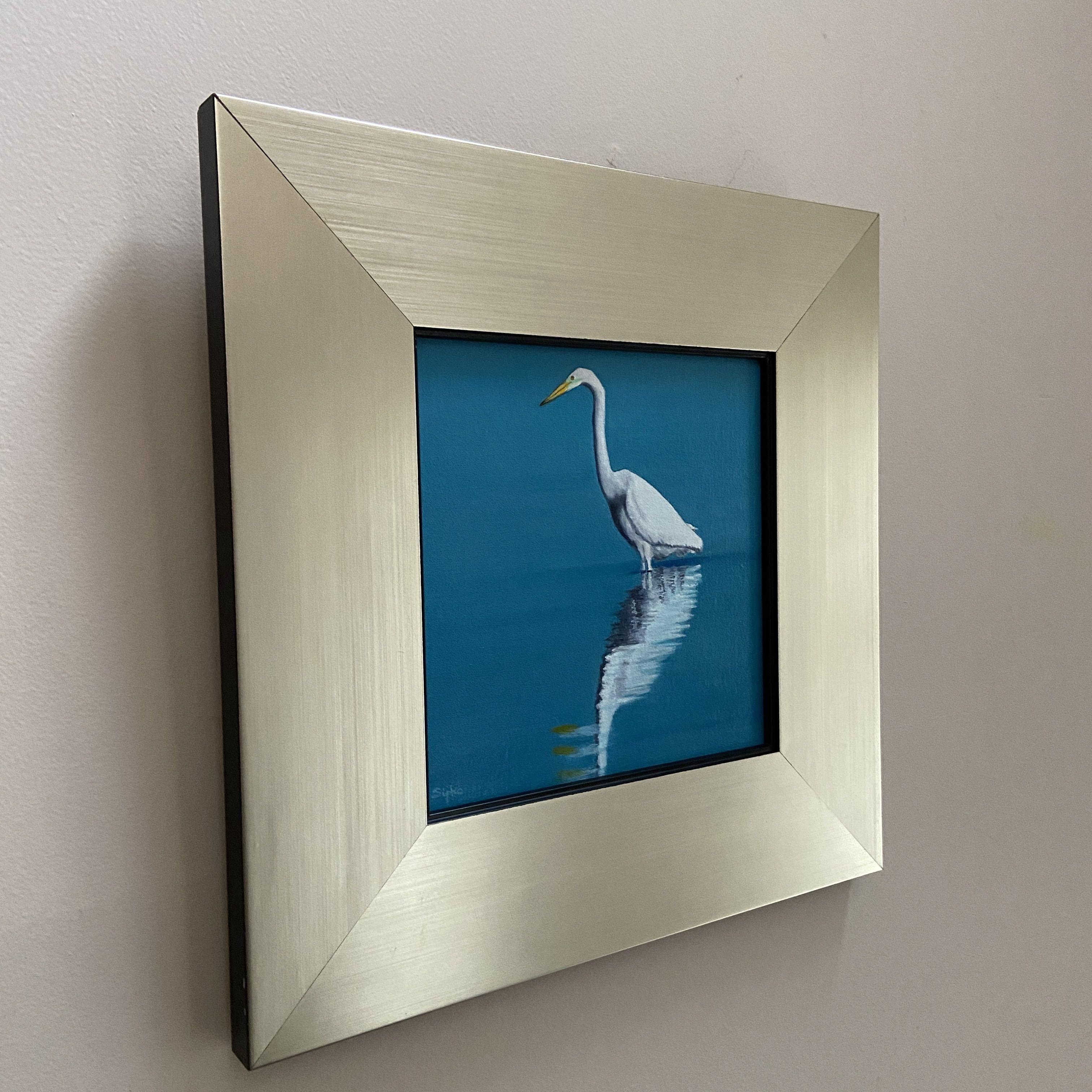 Dieses Bild zeigt einen Silberreiher, der morgens auf der Suche nach Futter in den Teich geht.  Es handelt sich um ein 8 x 8 großes Ölgemälde auf einer Tafel, das gerahmt und lackiert ist und aufgehängt werden kann.  Der Rahmen ist ein wunderschöner