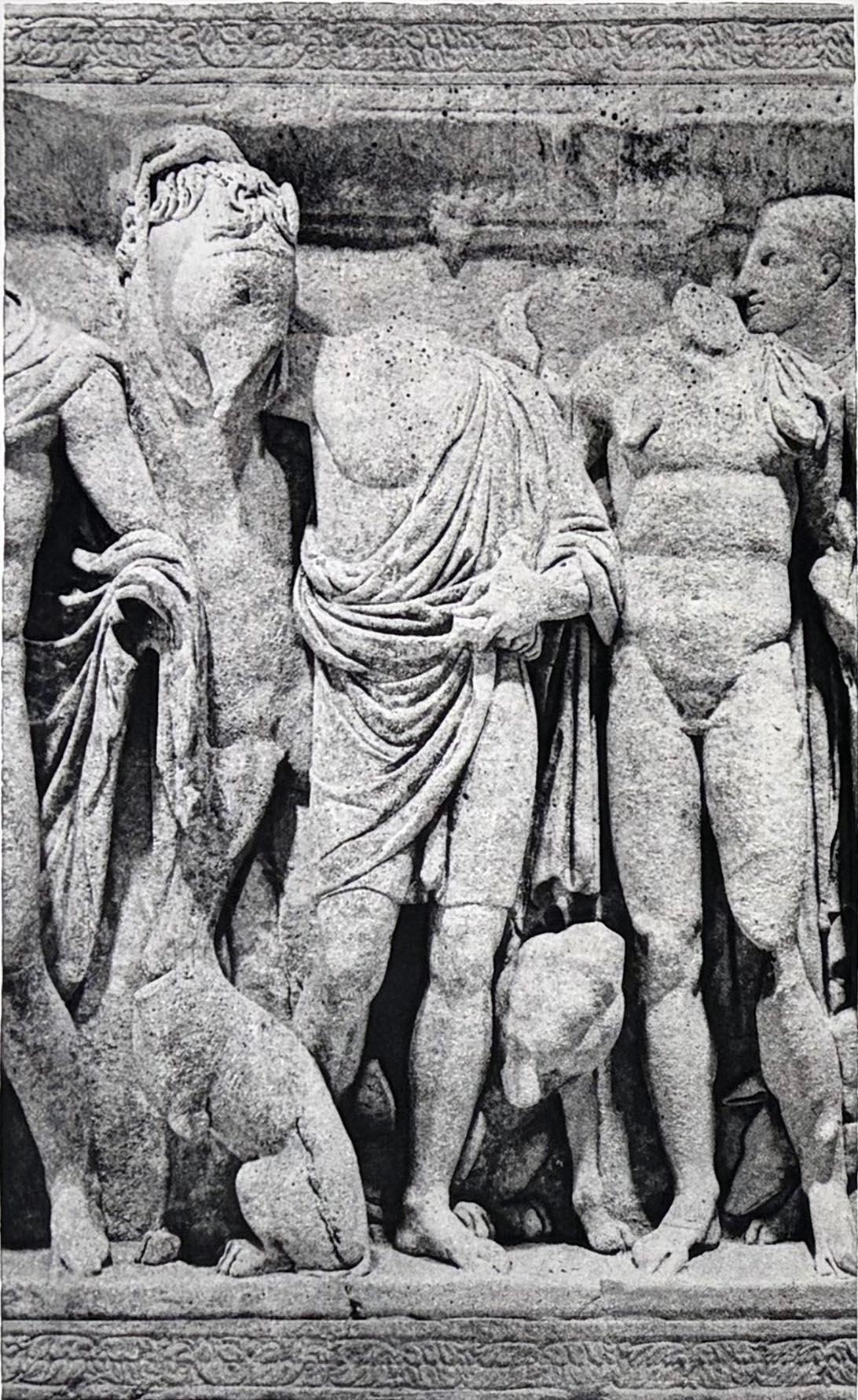 Los Romanos en Tarquena is a powerful photogravure by David Smith-Harrison, depicting a frieze of ancient Roman male figures rendered in striking sculptural detail. Presented as a triptych, the composition isolates three adjacent sections of the
