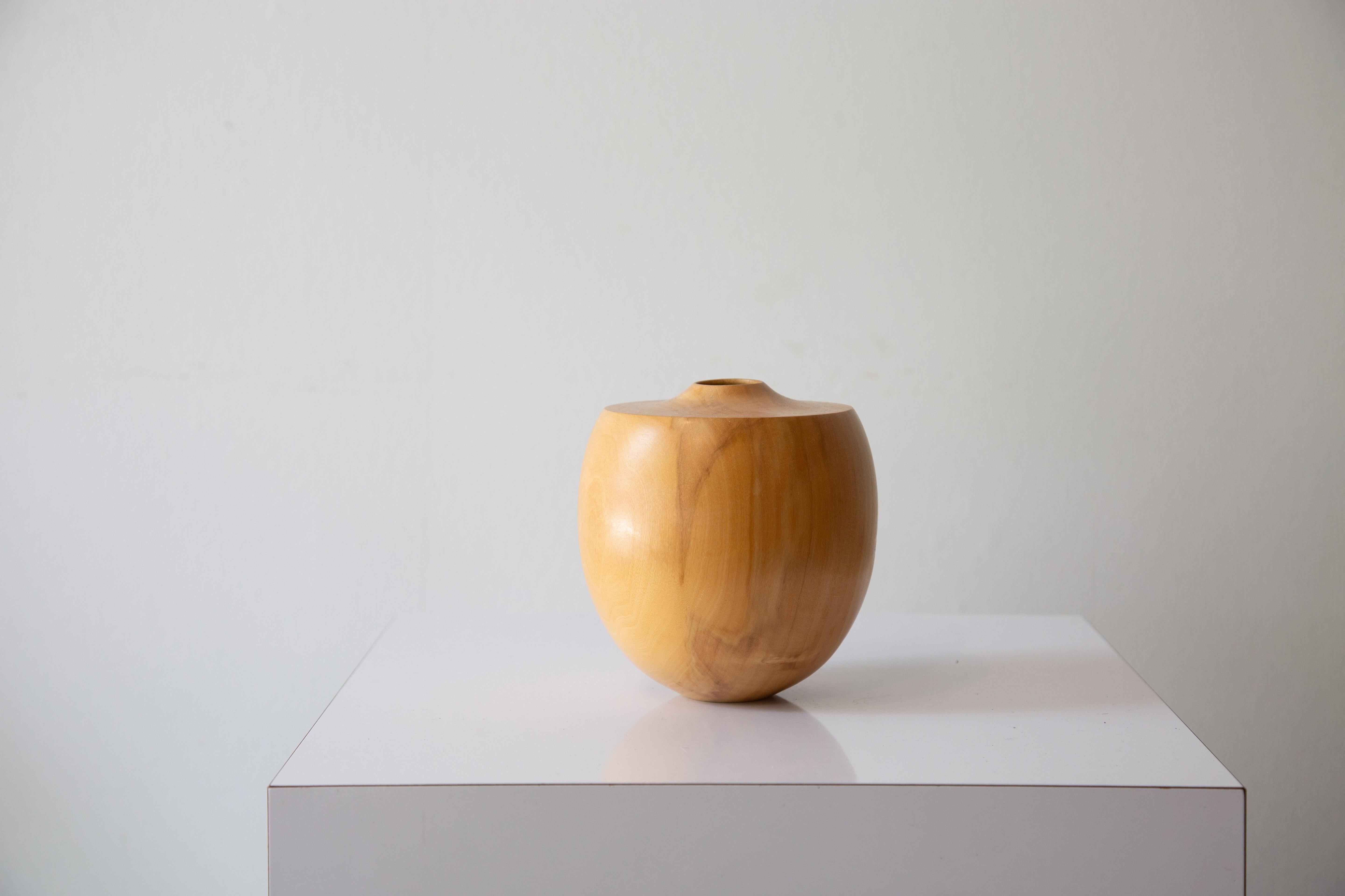 A Boxed Elder turned bud vase by Pennsylvania mooniest woodworker David Souza. A delicate form with a concave top which yields to an opening for stems. Character is provided from the spalting and wormholes. Signed on the bottom. Date of creation
