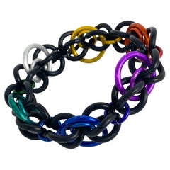 David Spada, bracelet jonc moderniste en aluminium et caoutchouc multicolore