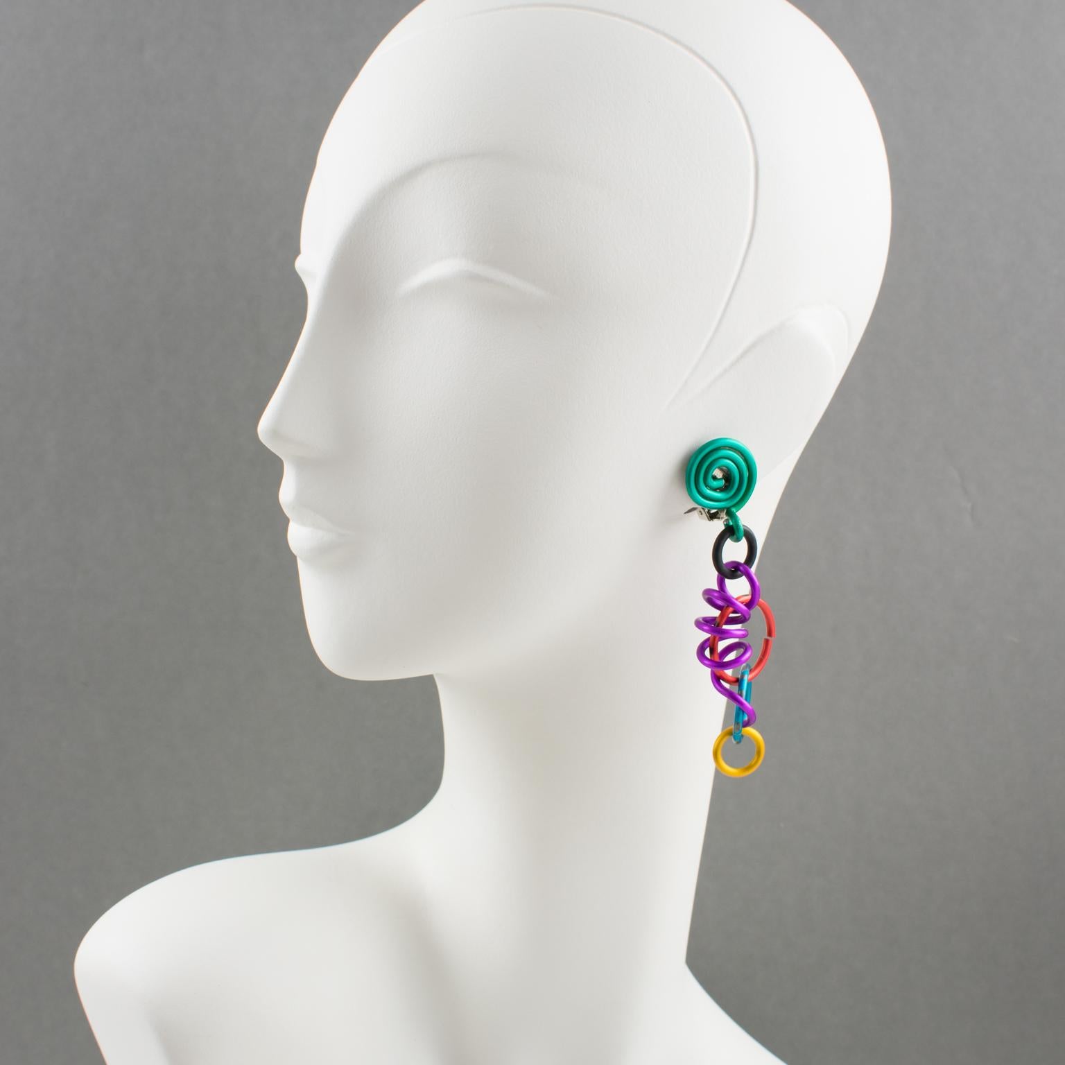 Rare elegant David Spada, New York signed dangling clip on earrings. Featuring a cool Space Age 1980s design with dangle articulated spiral coiled elements along with assorted size rings. Anodized aluminum metal with rich bright colors (turquoise,