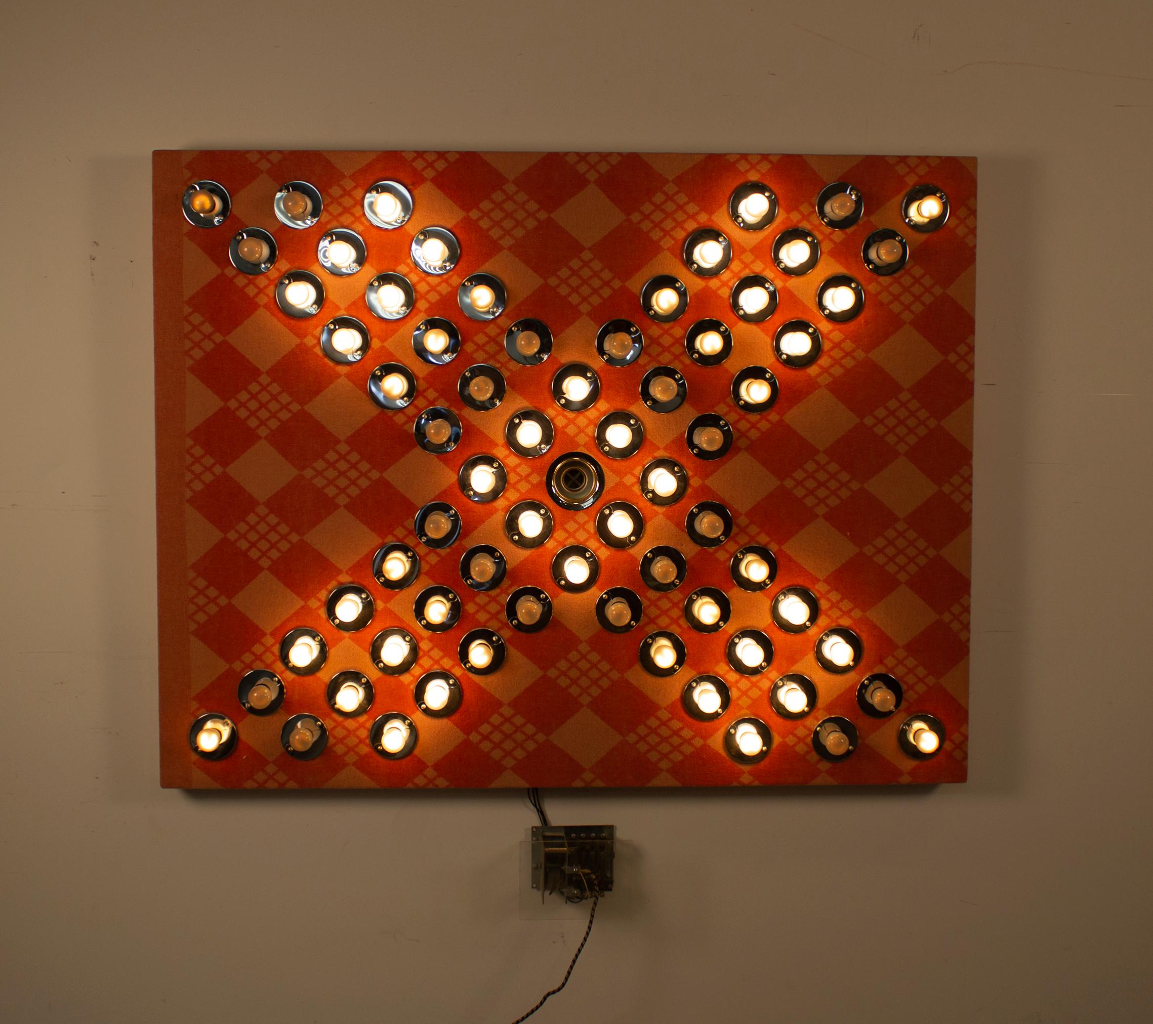 Sequential blinking light sculpture by contemporary artist David Szfranski. 

Blanket
Wood Substrate
Lights
Electronic Blinking mechanism.
Box 9