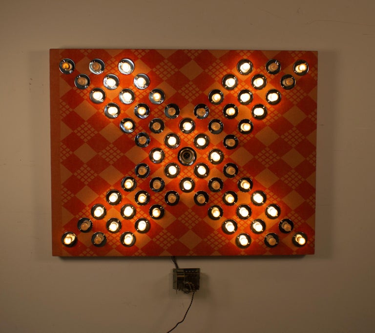 Sequential blinking light sculpture by contemporary artist David Szfranski. 

Blanket
Wood Substrate
Lights
Electronic Blinking mechanism.

Box 9