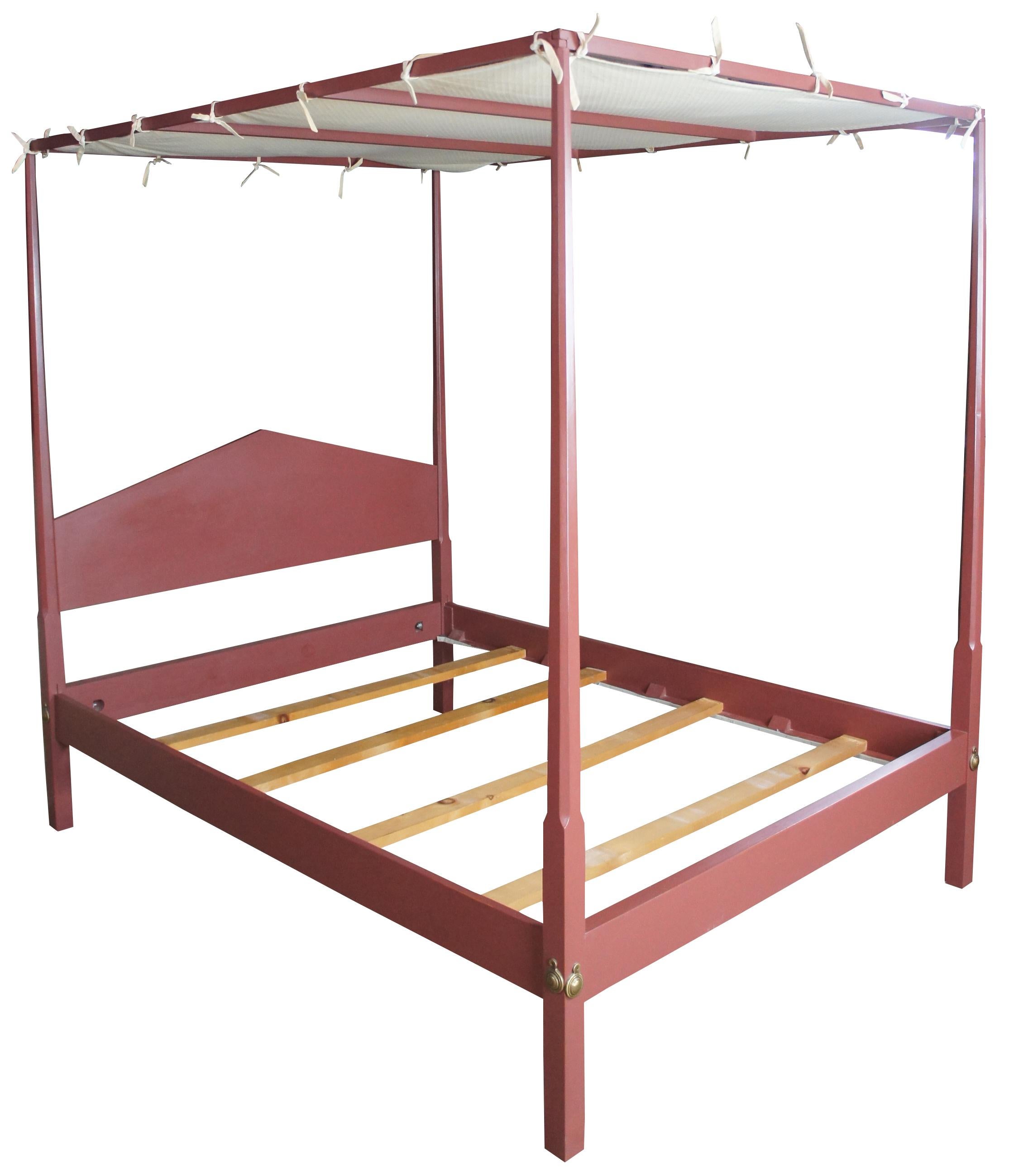 Early American painted queen size pencil post canopy bed by David T Smith, circa 1987. A style popularized in the late 1700s. Features a canopy with fabric, pencil posts and colonial hardware. Finished in Old Red.
   