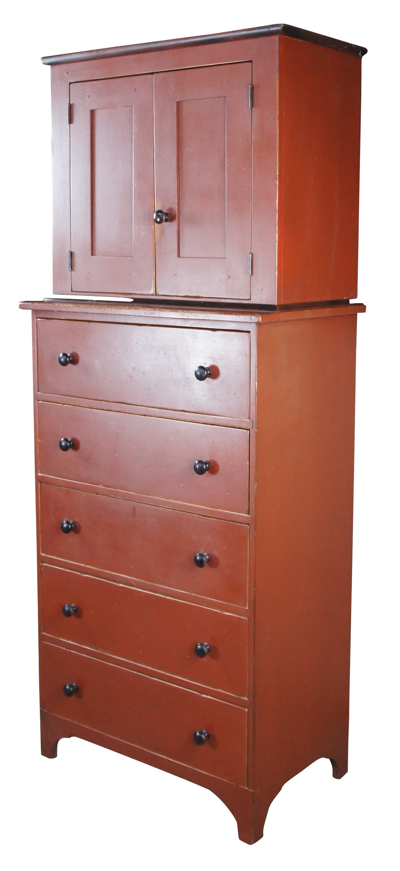 An impressive chest of drawers or linen press by David T Smith & Co of Morrow Ohio, circa 1986. Made from poplar with an old red crackled finish by artisan Jerry Ratliff. Features a tall case with wardrobe cabinet along the top. Includes mortise and