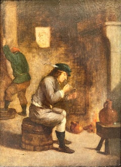 Hombre fumando en un barril