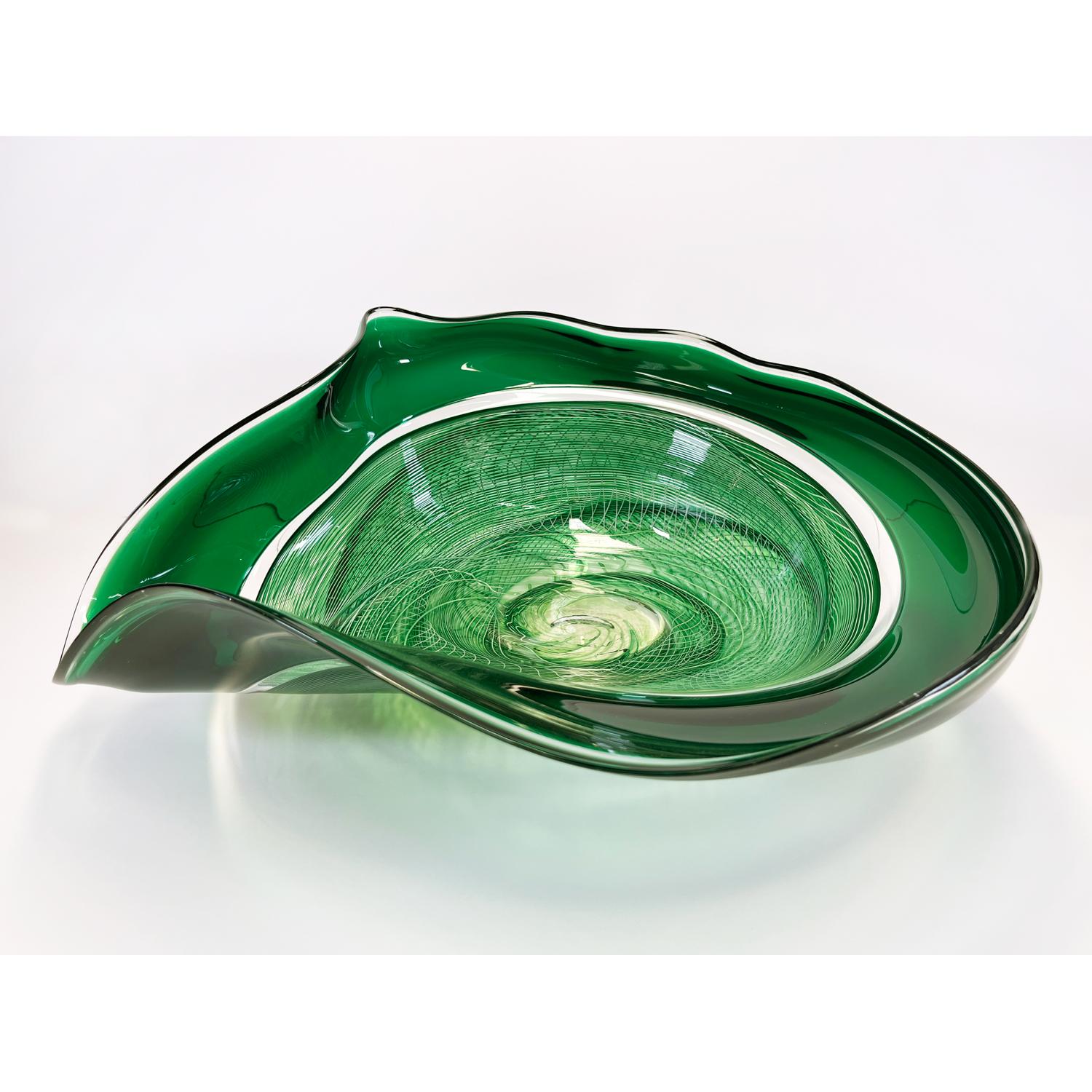 This Emerald Rondelle Bowl is a continuation of David's work with cane. Fusing his signature wave bowl motif with his newer rondelle cane pattern. This beautiful glass bowl is sure to be a showstopper in your space. 

David Thai is a Chinese