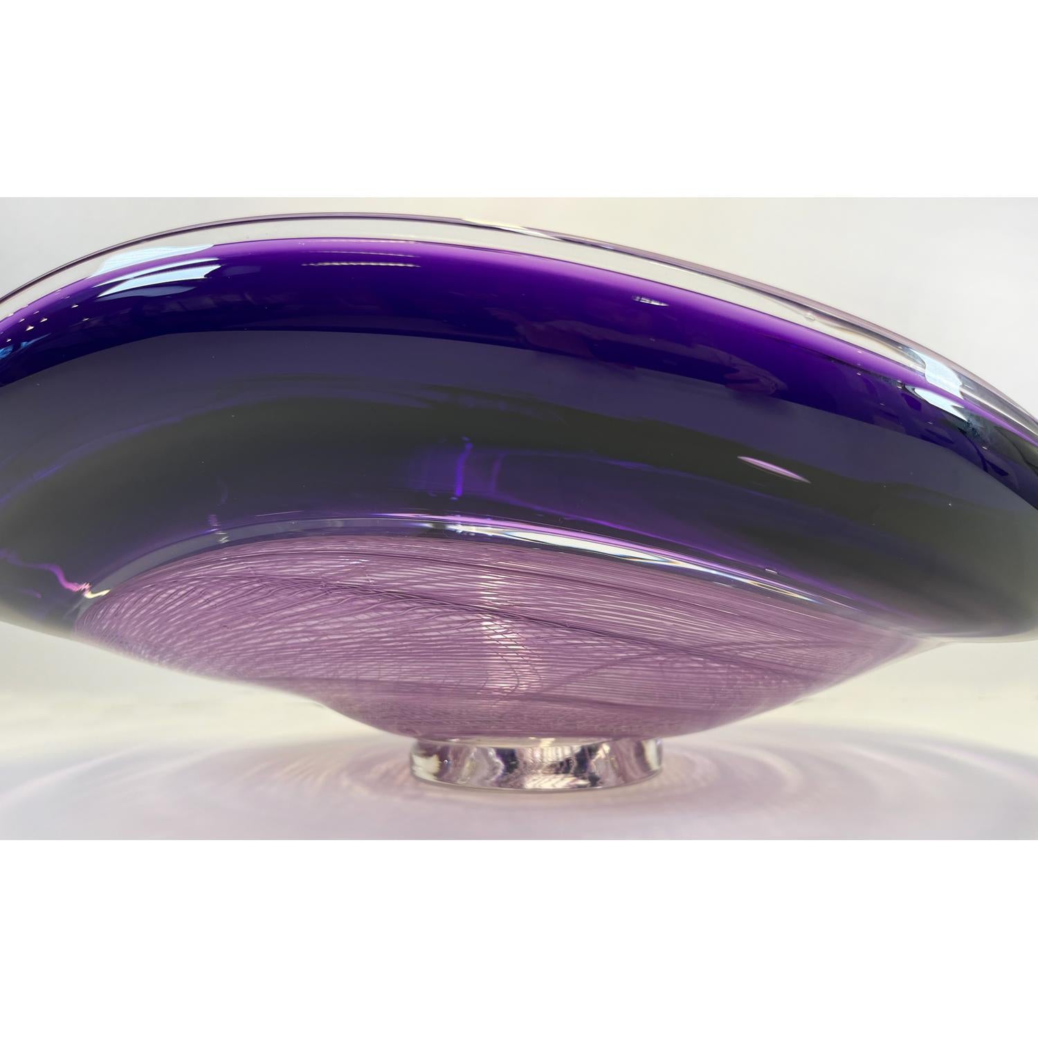 This Lilac/Amethyst Rondelle Bowl is a continuation of David's work with cane. Fusing his signature wave bowl motif with his newer rondelle cane pattern. This beautiful glass bowl is sure to be a showstopper in your space. 

David Thai is a Chinese