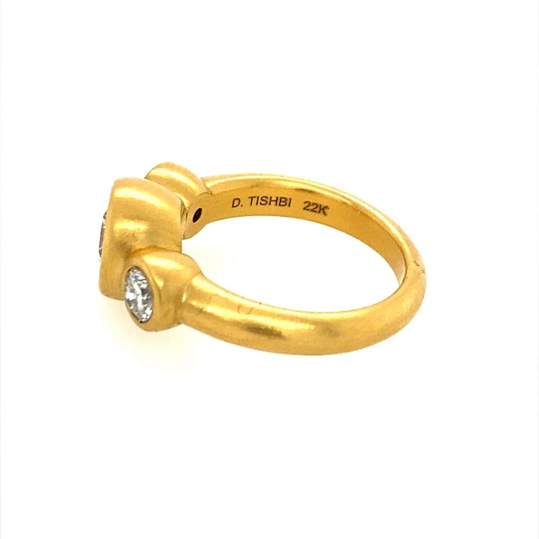 This 22 Karat Gold Three Diamond Engagement Ring is one of a kind and handcrafted in the Pacific Palisades.  With an elegant and modern design this ring has a weighted and comfortable fit.  This three diamond bezel setting is perfect for a modern