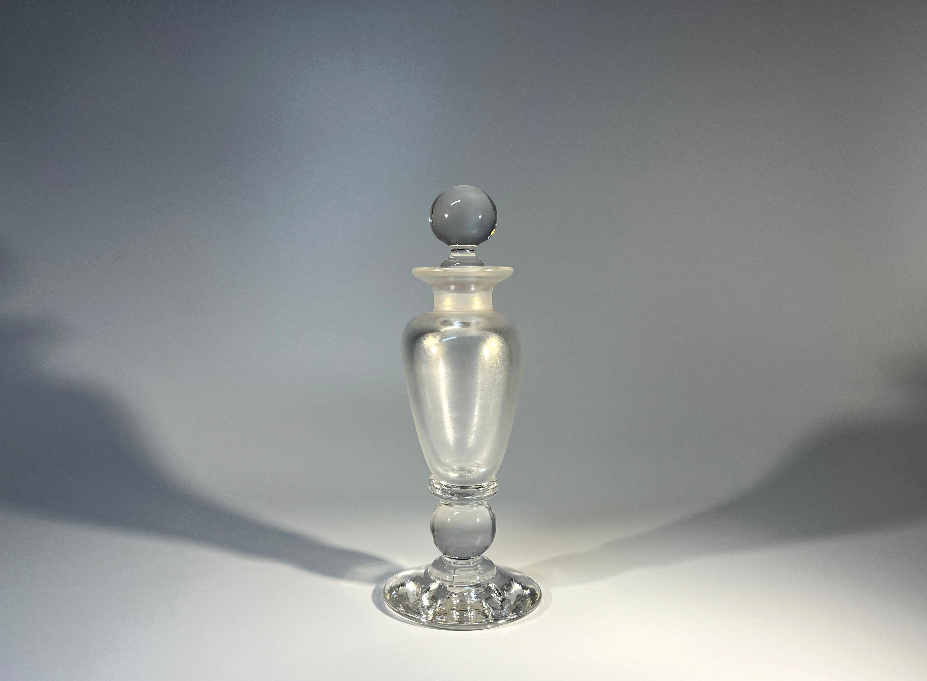 Sublime pearlescent, David Wallace of England, hand crafted glass perfume bottle
Perfectly understated and alluring 
Circa 1980's
Height 6.5 inch, Diameter 2.5 inch
In excellent condition
Wear consistent with age and use