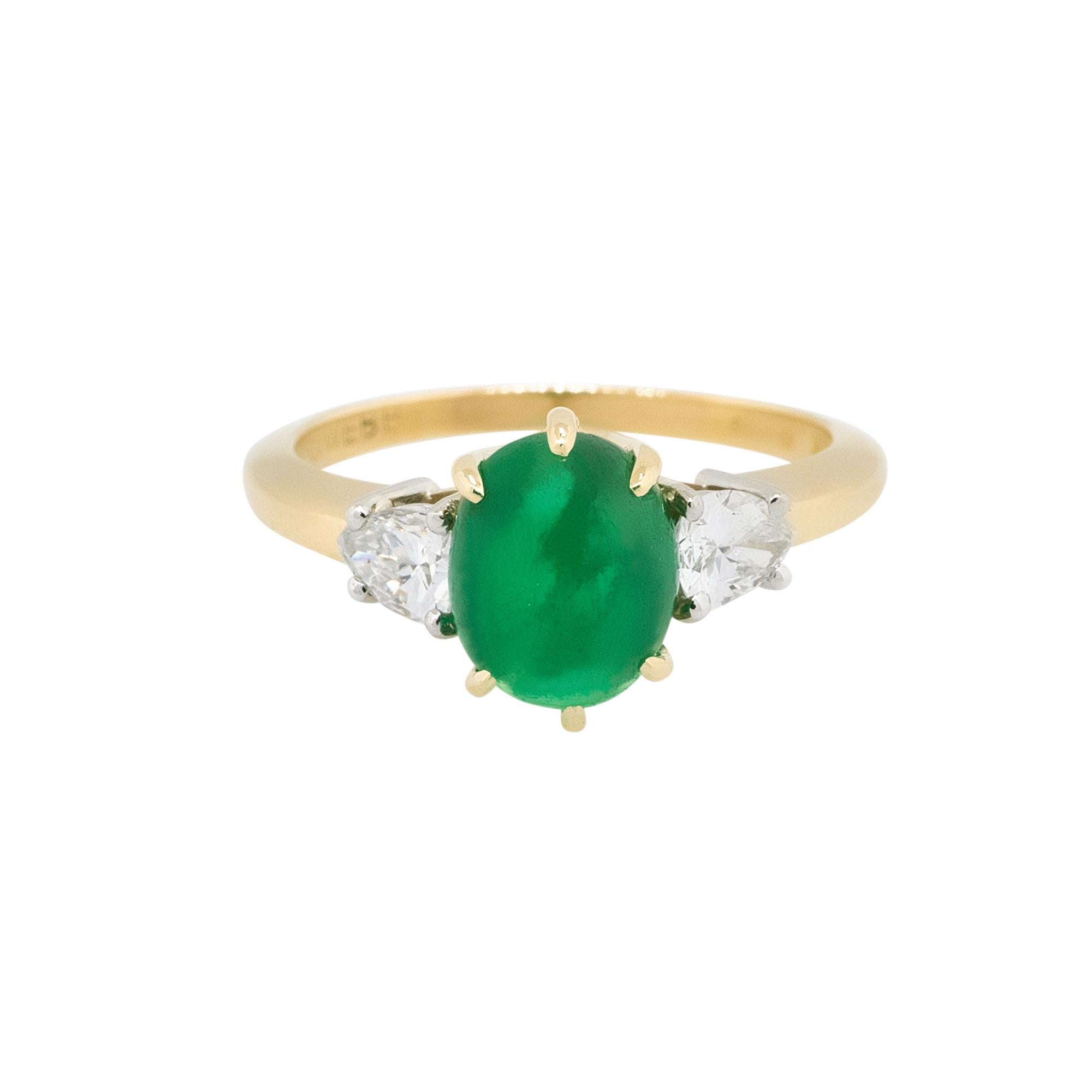 Material: 18k Yellow Gold
Diamond Details: Approx. 0.45ctw of pear shaped Diamonds. Diamonds are G/H in color and VS in clarity
Gemstone Details: Oval shaped Emerald cabochon
Ring Size: 5.5
Total Weight: 3.9g (2.5dwt)
Measurements: 19.40mm x 9.60mm
