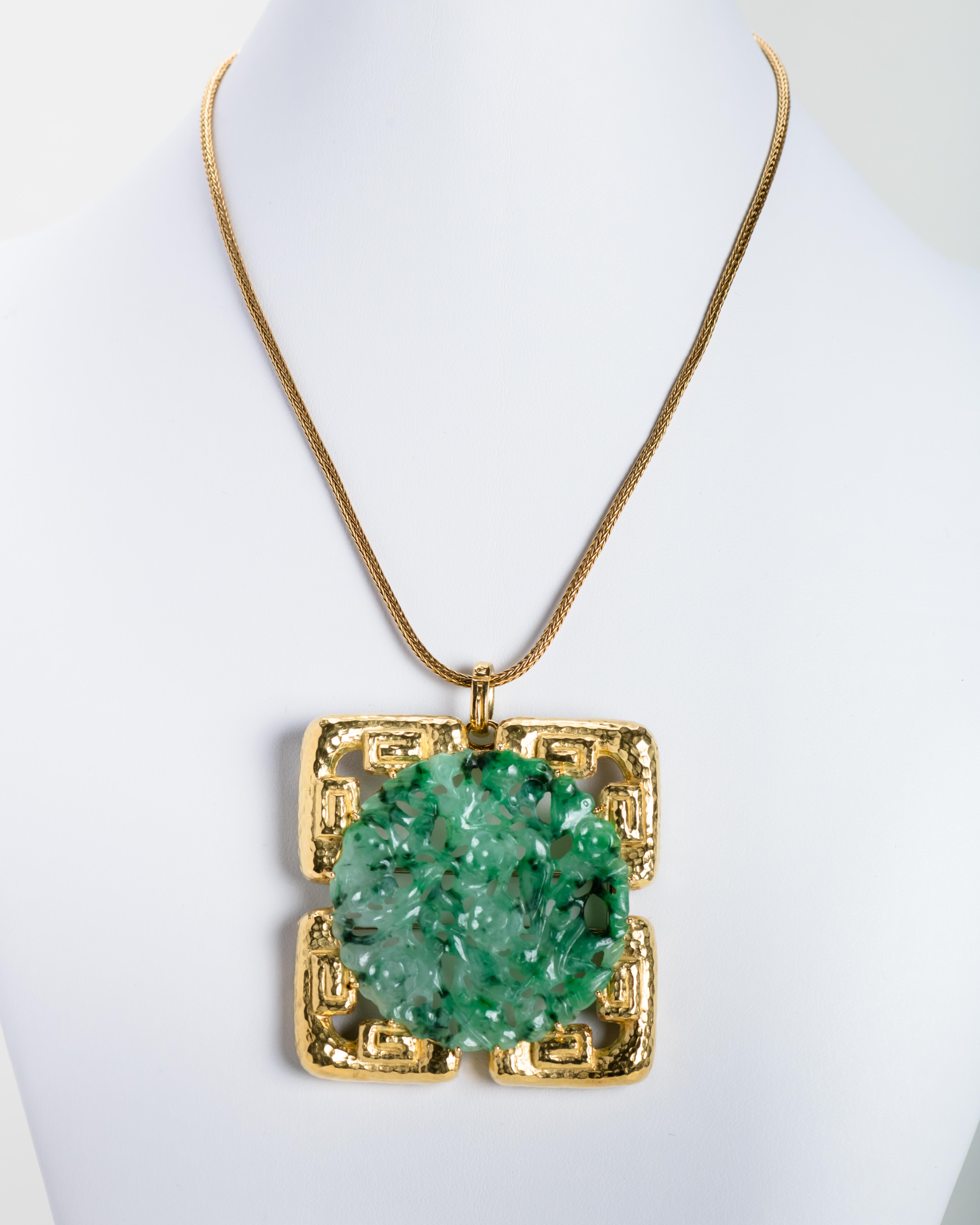 David Webb 18 karat gold pendant/brooch with a geometric rectangular design inset with circular jadeite carving. Circa 1965.

14 Karat gold necklace included.

Size: 2.25