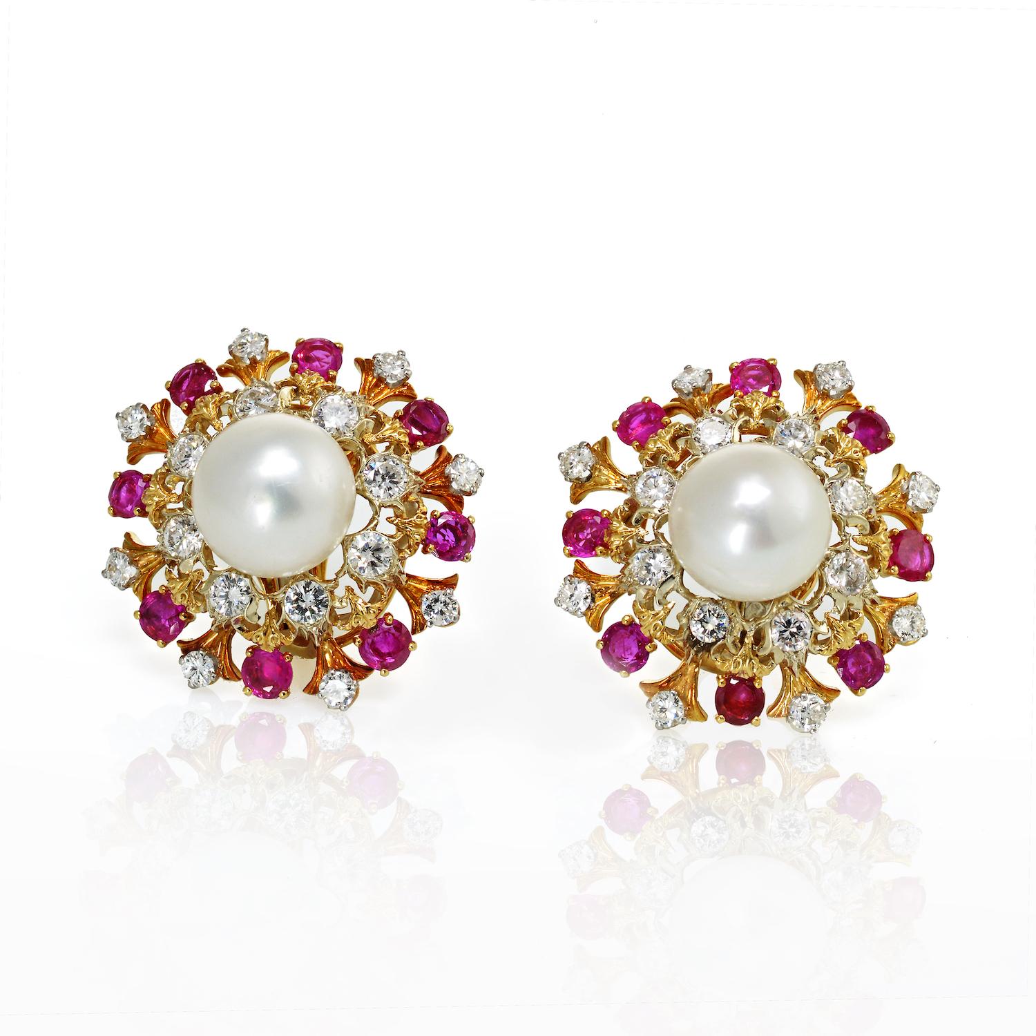 Pair of Two-Color Gold, South Sea Cultured Pearl, Diamond and Ruby Earclips, David Webb
18 kt., centering 2 pearls approximately 13.4 and 13.1 mm., encircled by two rows of 32 round diamonds approximately 4.00 cts., and 16 round rubies approximately