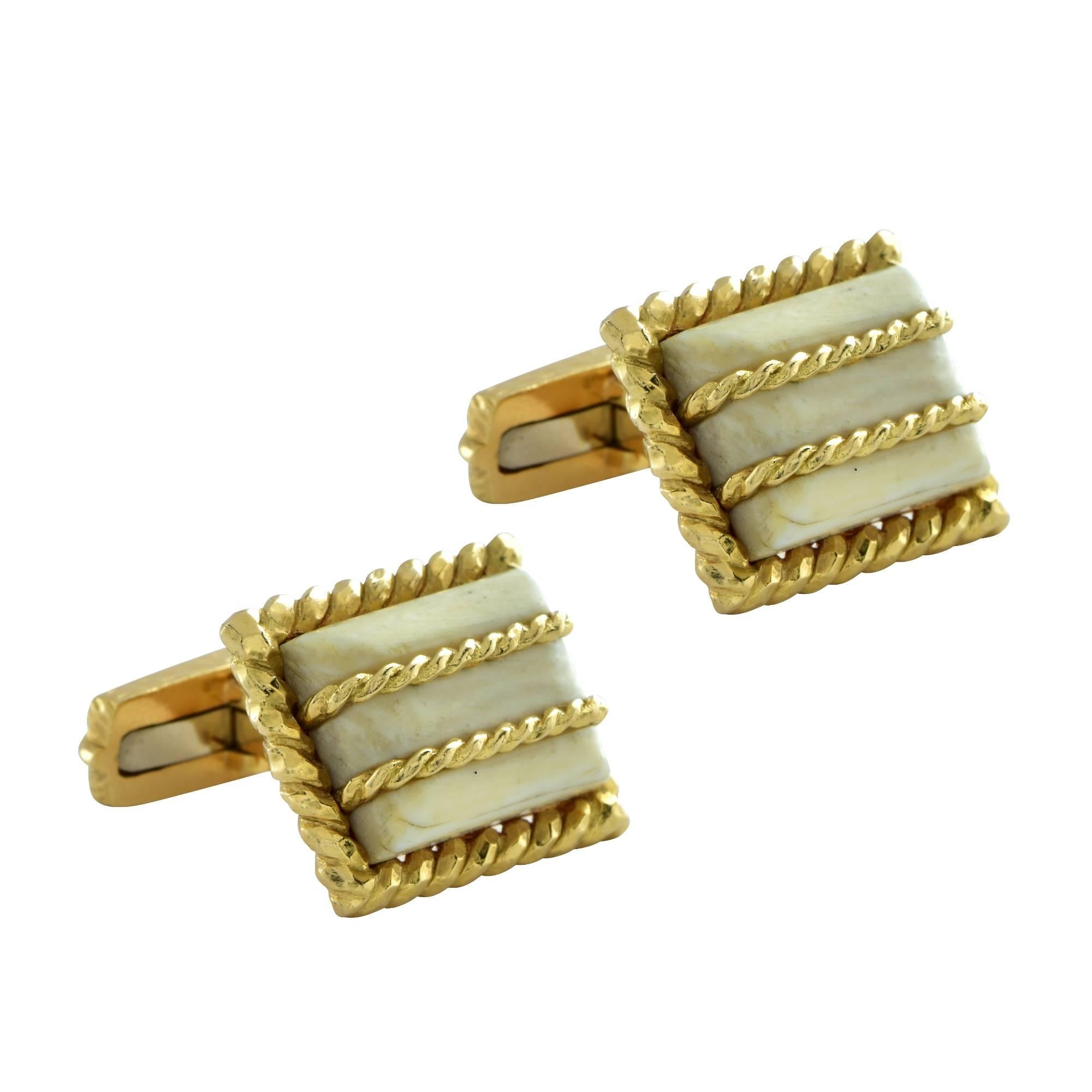 Elegant David Webb 18 Karat Yellow Gold and bone cufflinks. These cufflinks feature a rectangular faced cabochon crafted from bone, framed in 18 karat yellow gold twisted rope , with twisted 18 karat yellow gold rope detail across the face of the