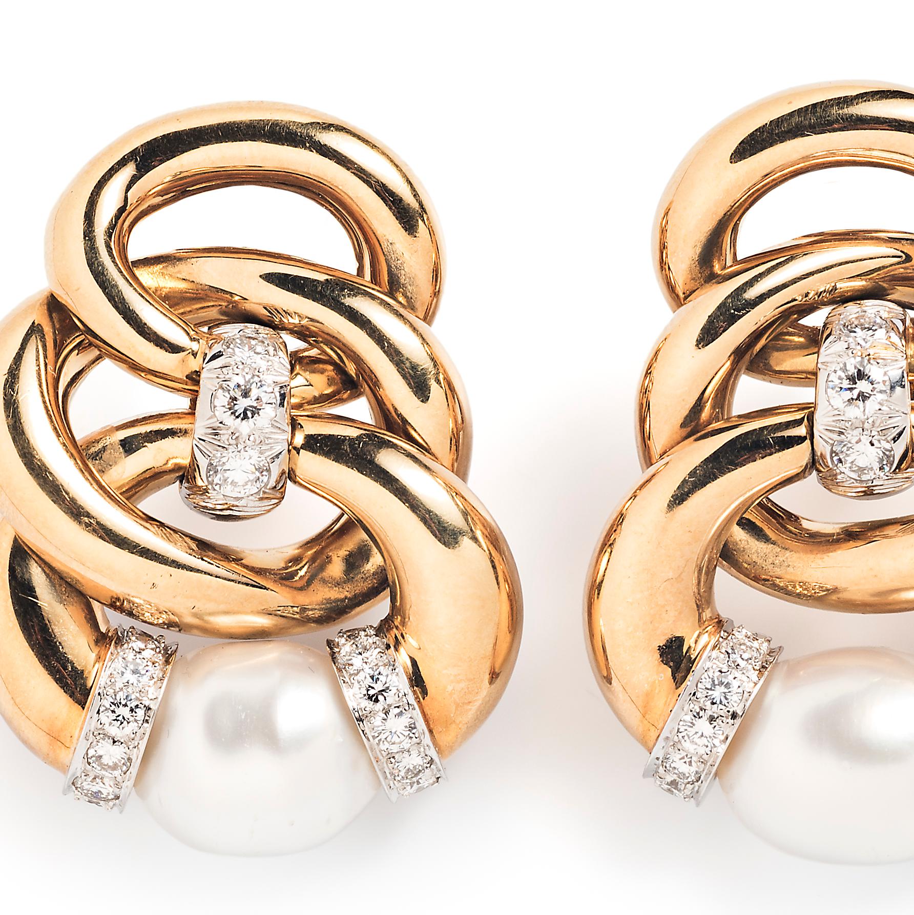 David Webb’s sense of modernity and polish is on full display in these opulent ear clips from the 1960s. Three 18k yellow gold interlocking links are embellished with baroque pearls and diamond accents. 

1.60” long by 1.13” wide 
Approximately 1.50