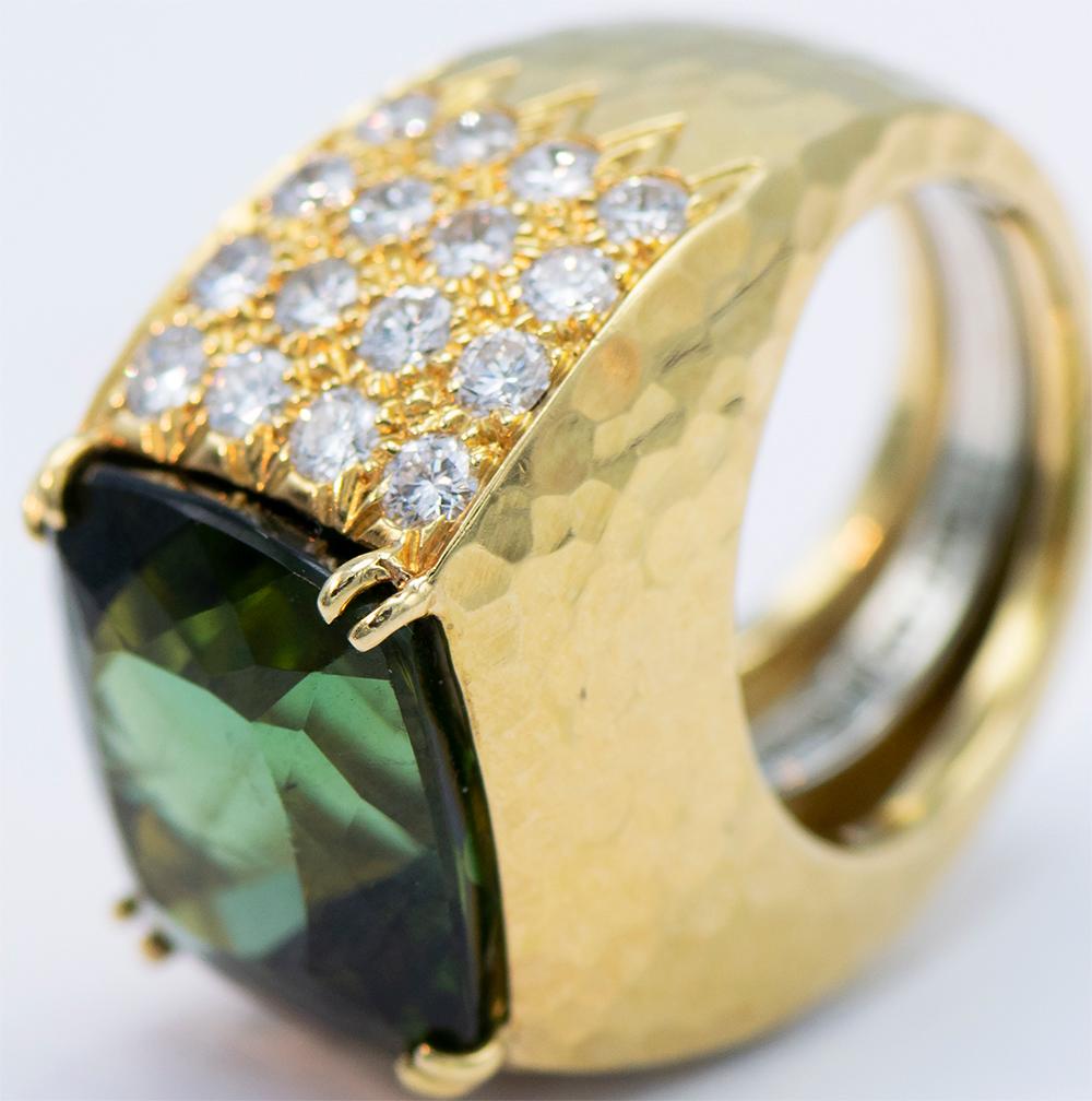 Platinum and 18KT Yellow Gold with Green Tourmaline measuring 15.23mm x 13.97mm x 9.40 mm with 32 brilliant diamonds approximately 0.64 carats and 23.6 grams dwt. Size 5 1/2 with ring guard. Signed Webb, PT & 18KT.
