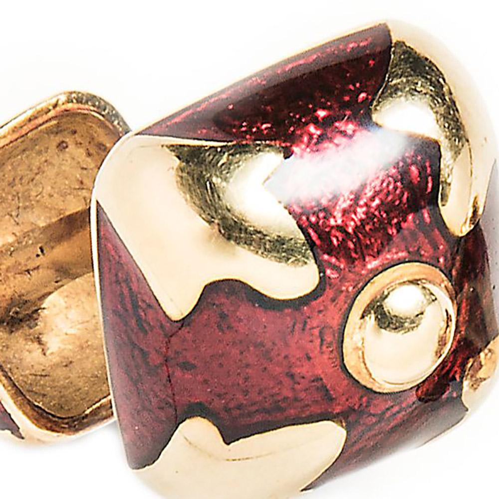 David Webb is known for geometric designs rendered in enamel. These bombé form cufflinks feature cushion-shaped panels of red enamel quartered by gold clover shapes centering on polished gold domes.

0.52” long x 0.52” wide
18k yellow gold
Red