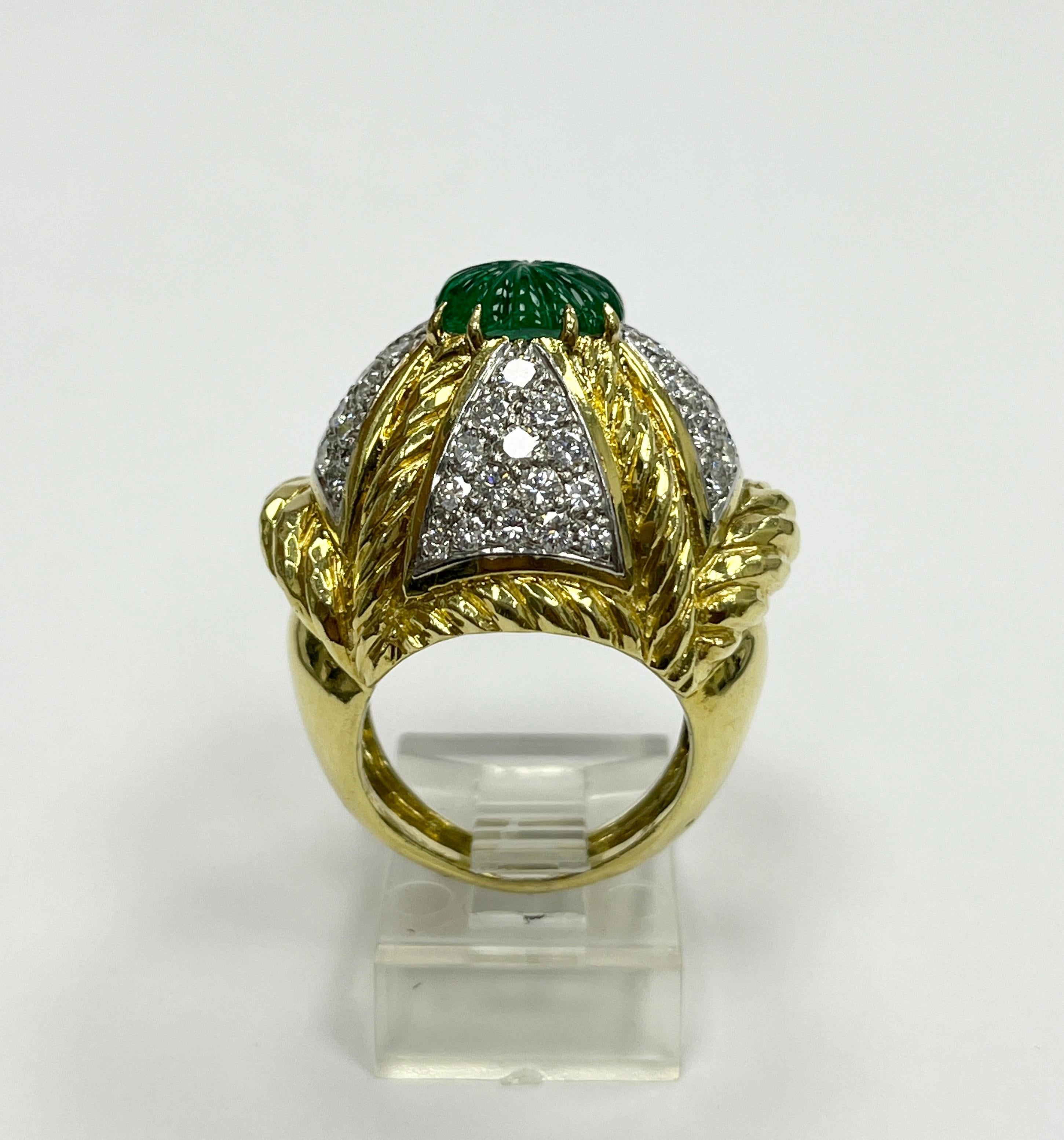 1970' David Webb, 18K yellow gold and platinum diamond and carved emerald ring with 58 diamonds
approx 3.00 cts, D - E color VVS - VS clarity 
Weight 14.7 g
Marked DAVID WEBB 18K 900 PT
Ring top ~ 23.5 x 28 mm
Ring size: 5.75