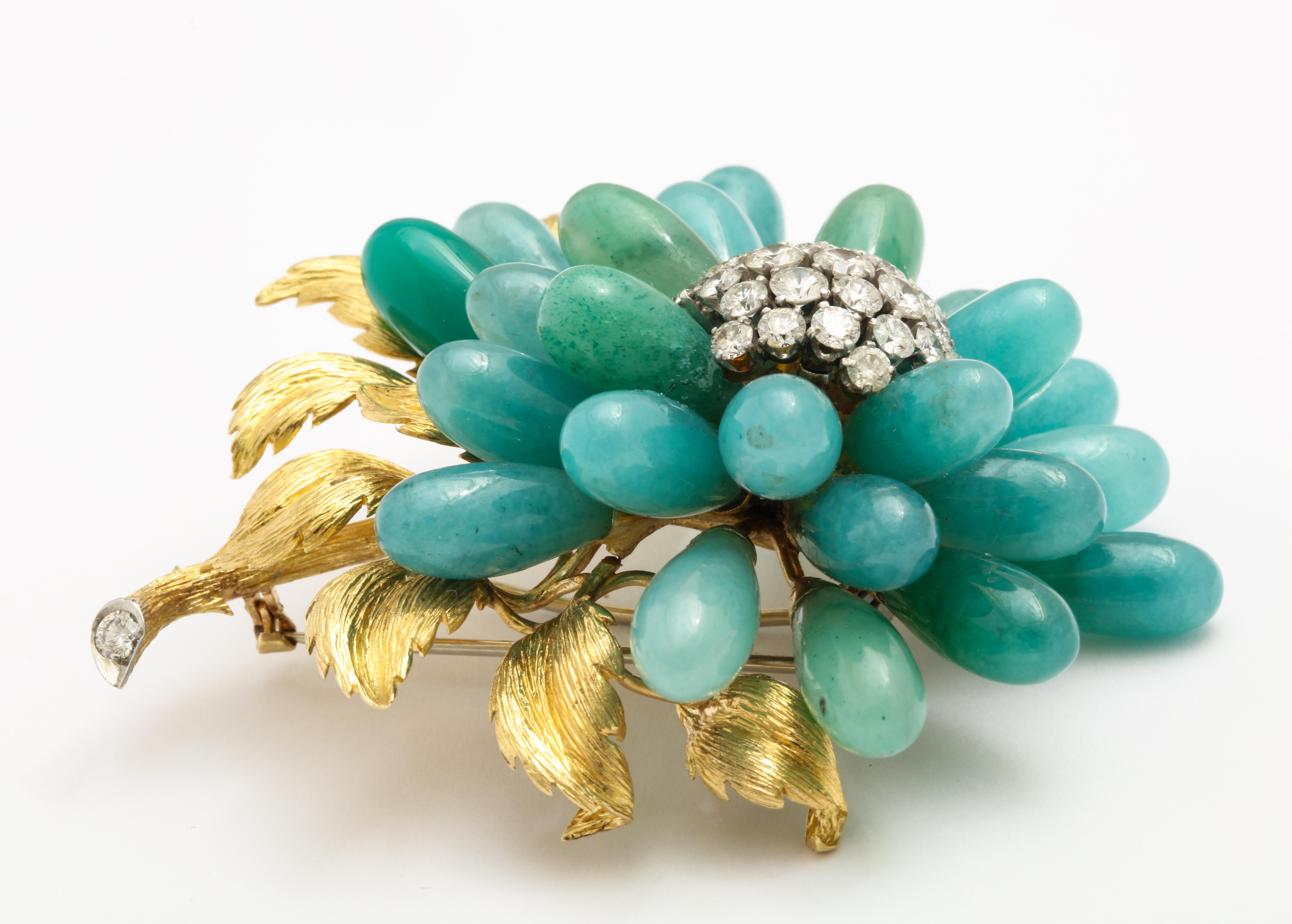 An extraordinary brooch by an American icon in jewelry design, David Webb.  This pin has volume, dimension and a fabulous mix of texture and color.  Beautifully hand finished florentine gold leaves, and masterfully arranged jadeite and chrysoprase