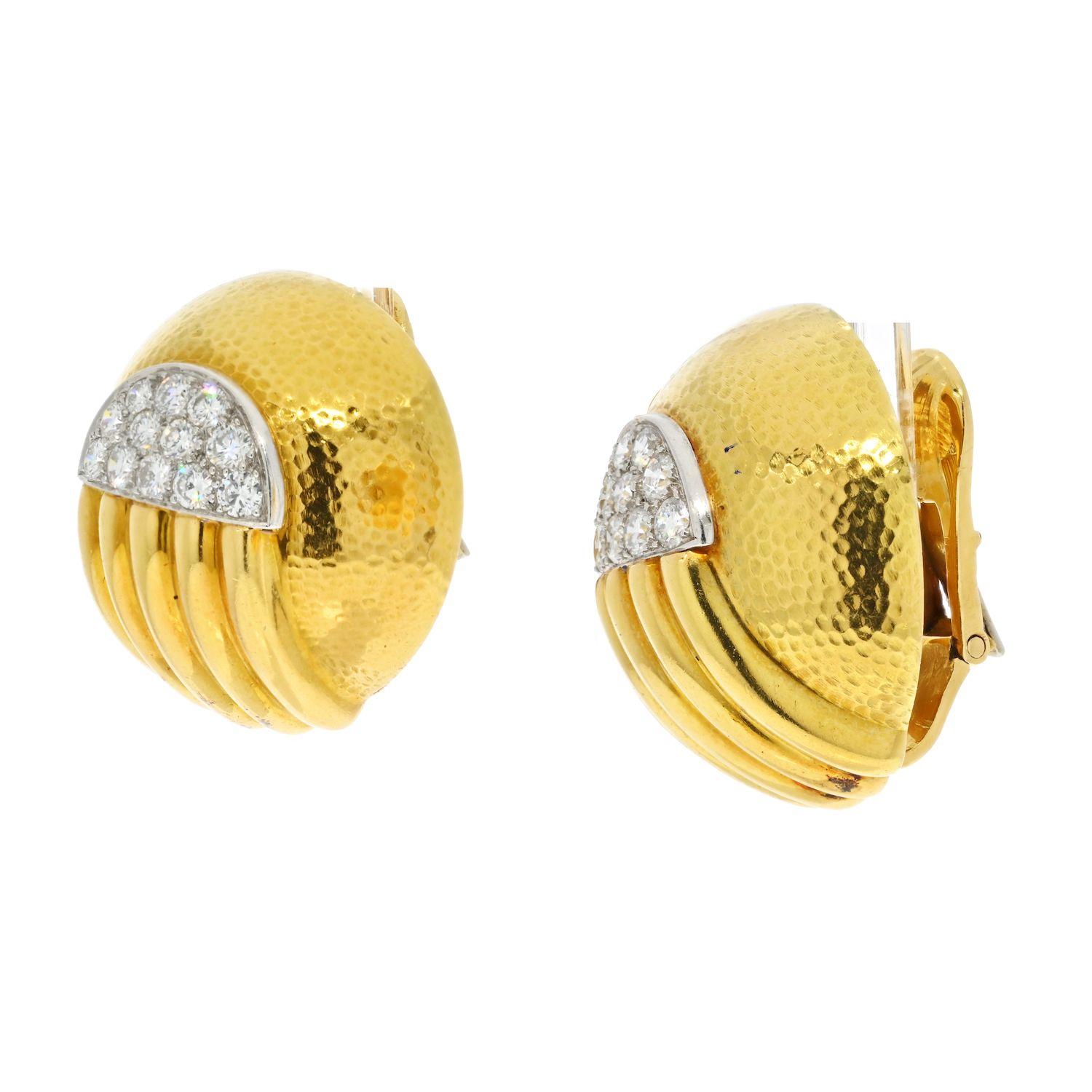 These stunning and bold David Webb Diamond Dome Round Clip On Earrings are made in 18k yellow gold and platinum. Accented with round cut diamond as accented. Finished with signature David Webb hammered finish, fastens with a heavy clip. 
22mm wide.