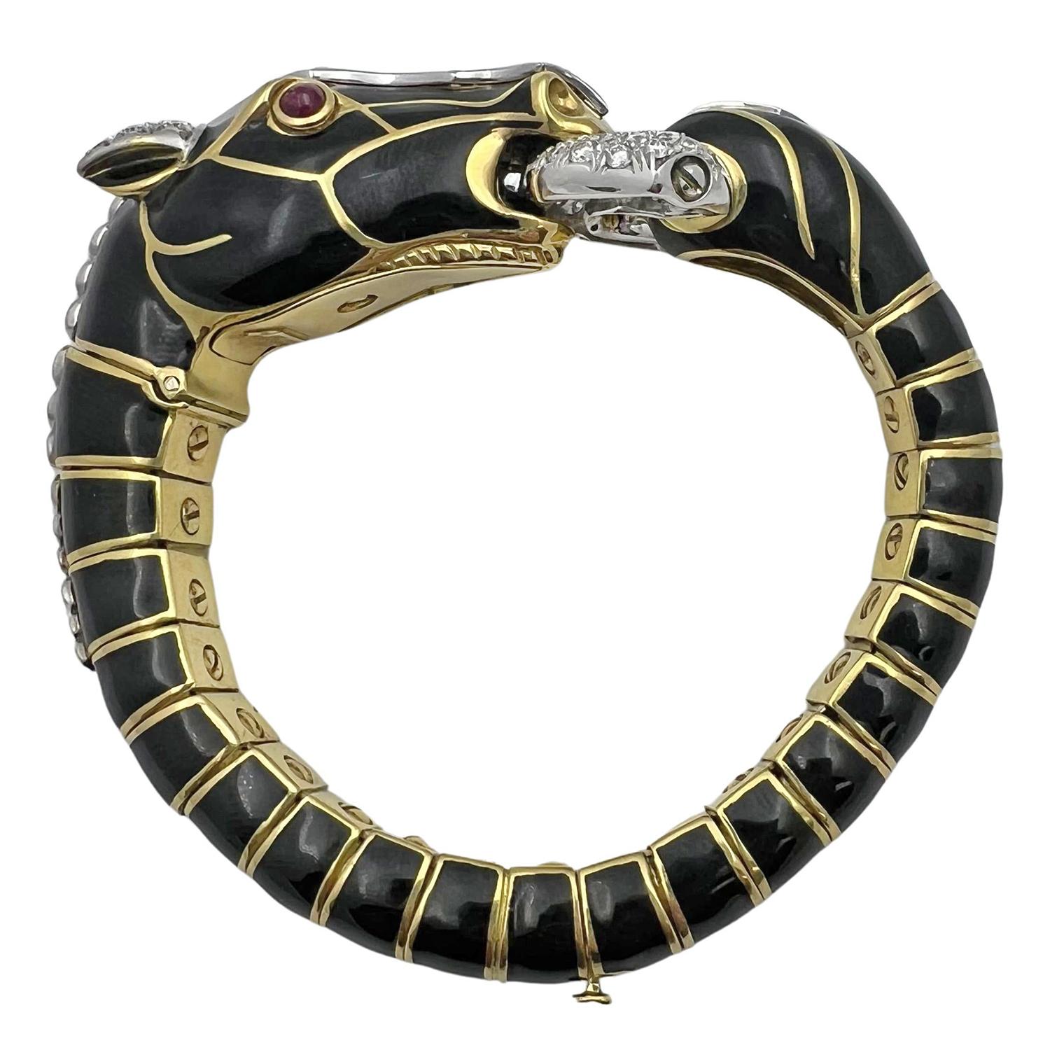 David Webb stylized horse bracelet, decorated in black enamel enhanced by pavé-set round diamonds at the center of the face, ears and bit, along with cabochon ruby eyes.  Handcrafted in 18k yellow gold and platinum.  Bangle is fully articulated with