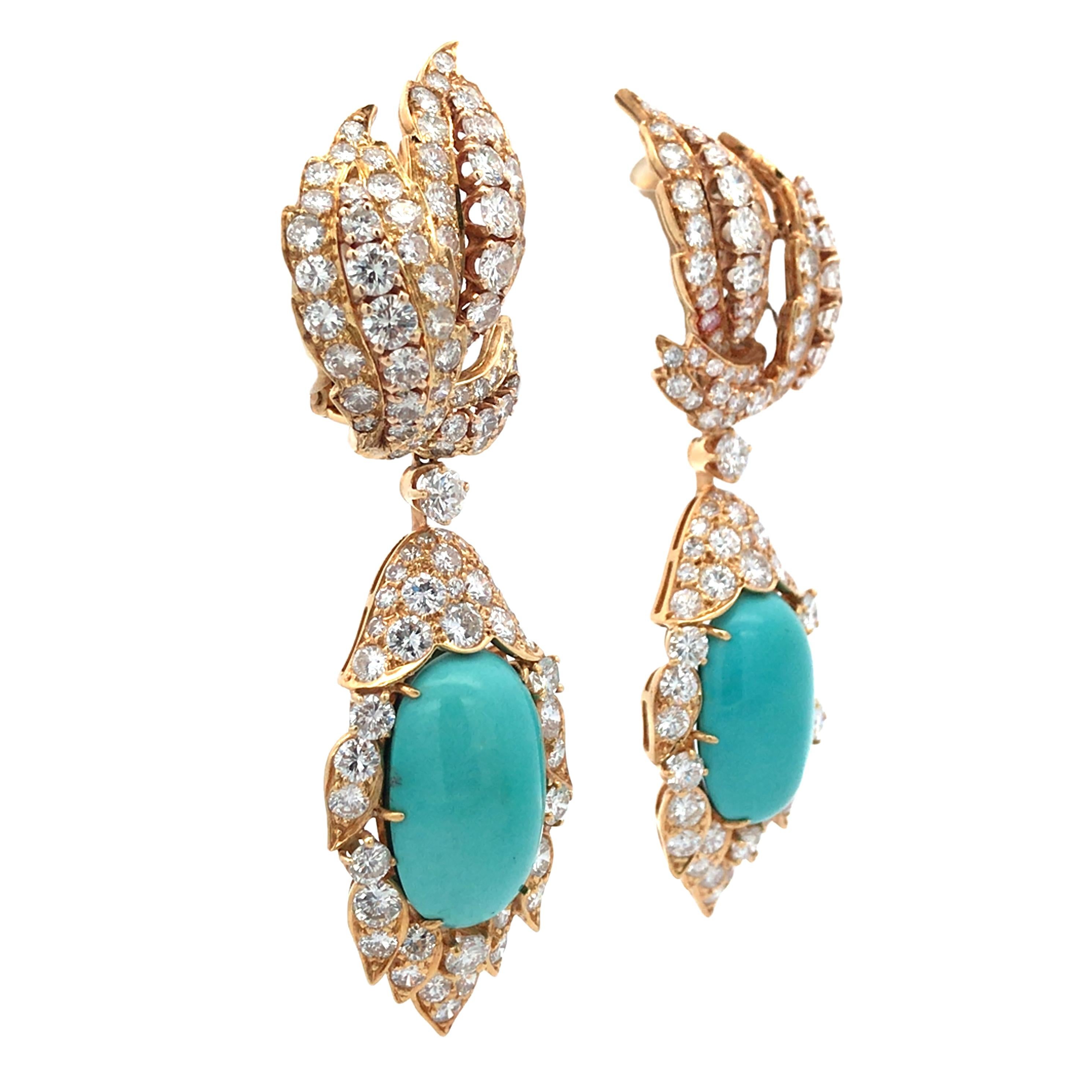 These stunning earrings by David Webb are a perfect blend of elegance and vibrancy. Crafted in 18K gold, they feature a striking combination of turquoise stones, each measuring 21.3 cm, set against a backdrop of dazzling diamonds. The earrings