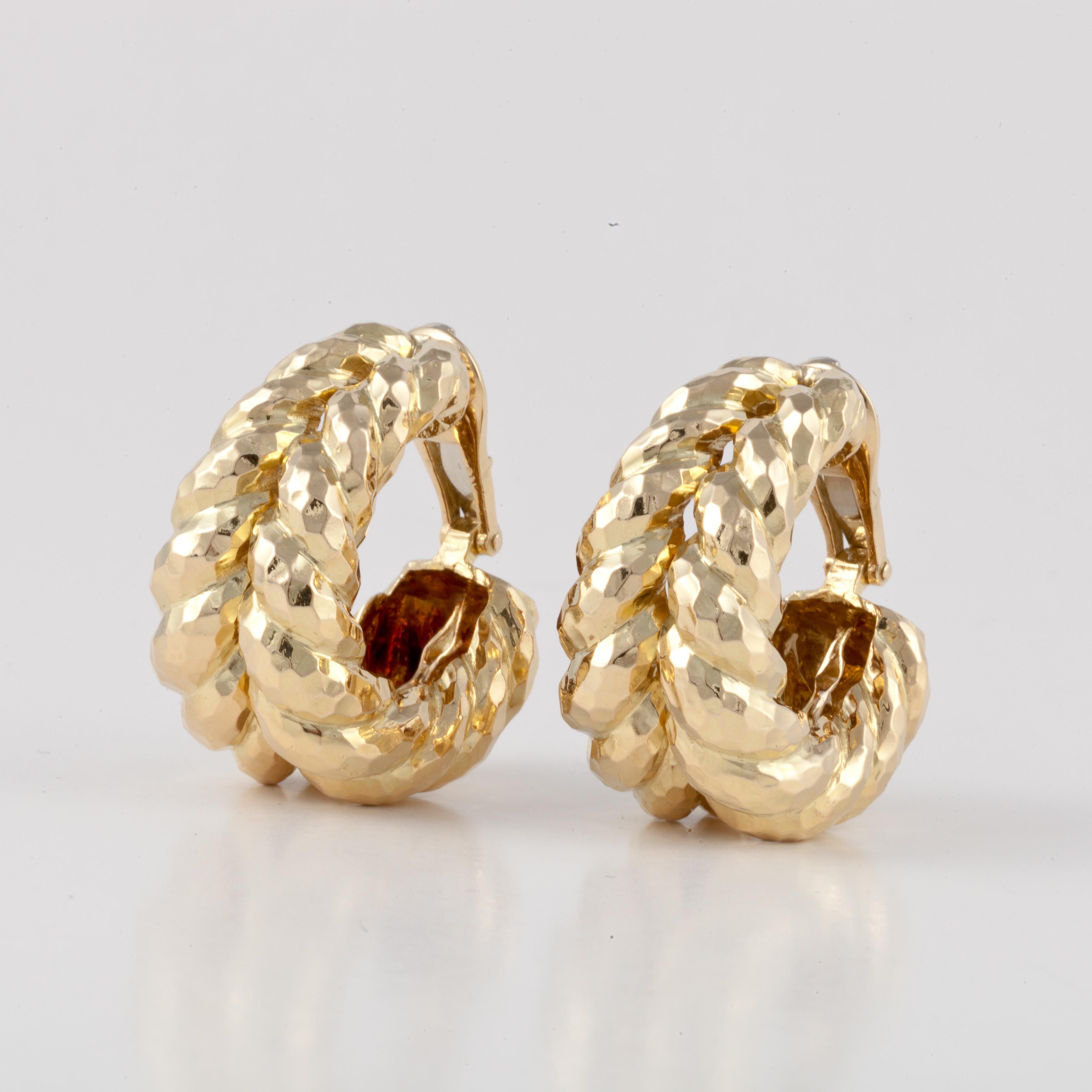 David Webb large semi-hoop earrings in 18K yellow gold with a hammered finish.  They measure 1 1/8 inches long and 5/8 inches at the widest point.  They are clip style earrings.